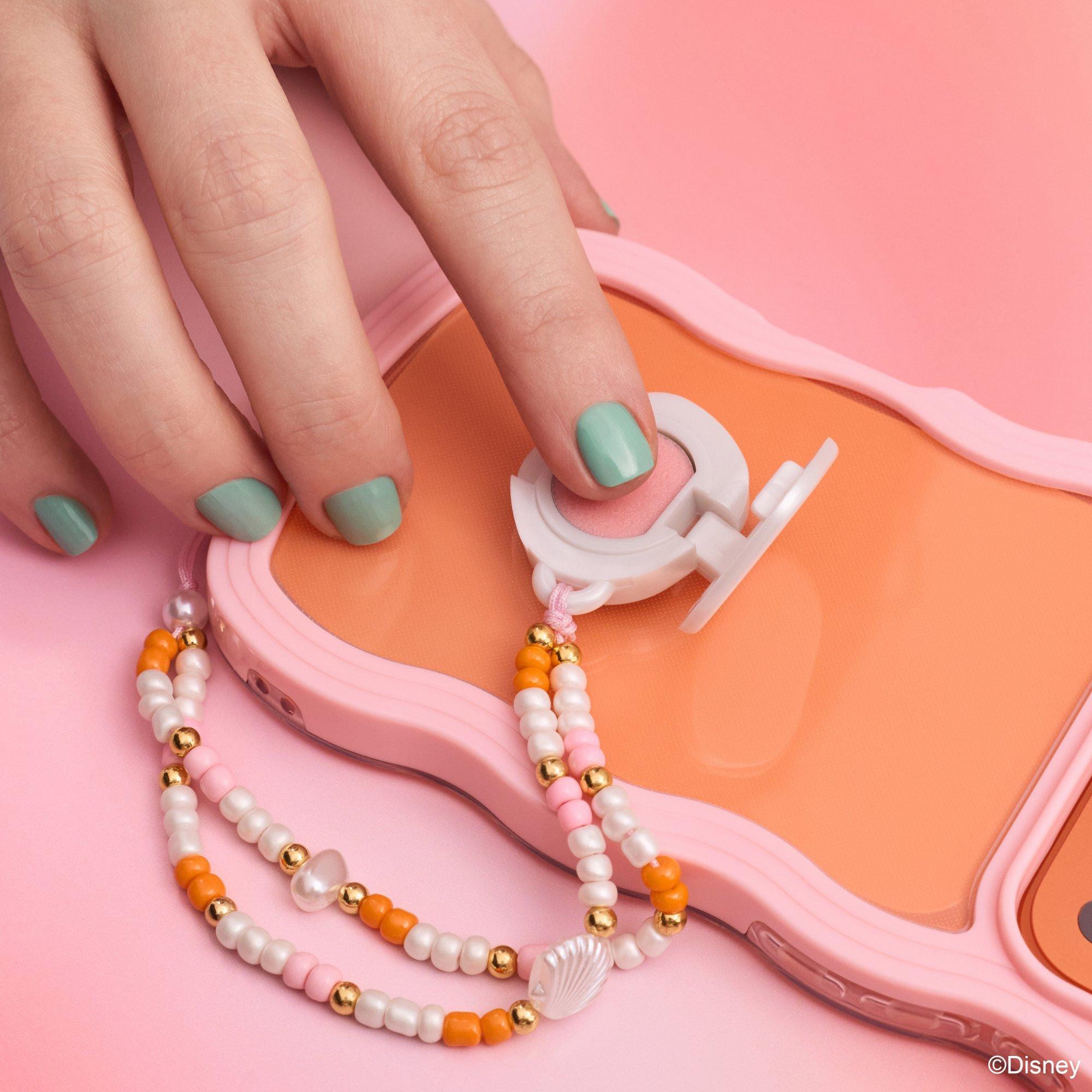 Balsamo labbra con charm per telefono Disney HE LITTLE MERMAID.