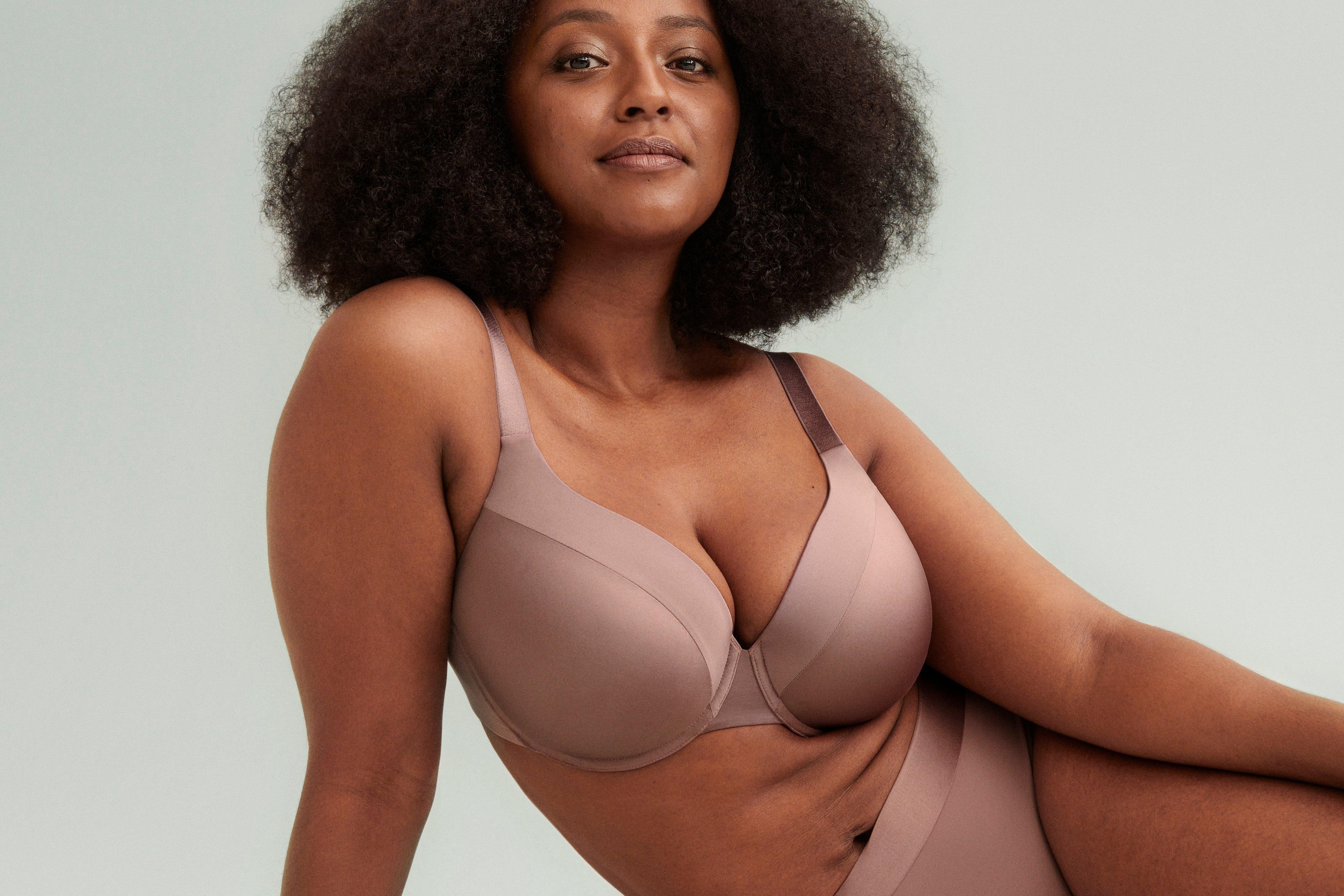 A woman in a beige Dahlia bra.