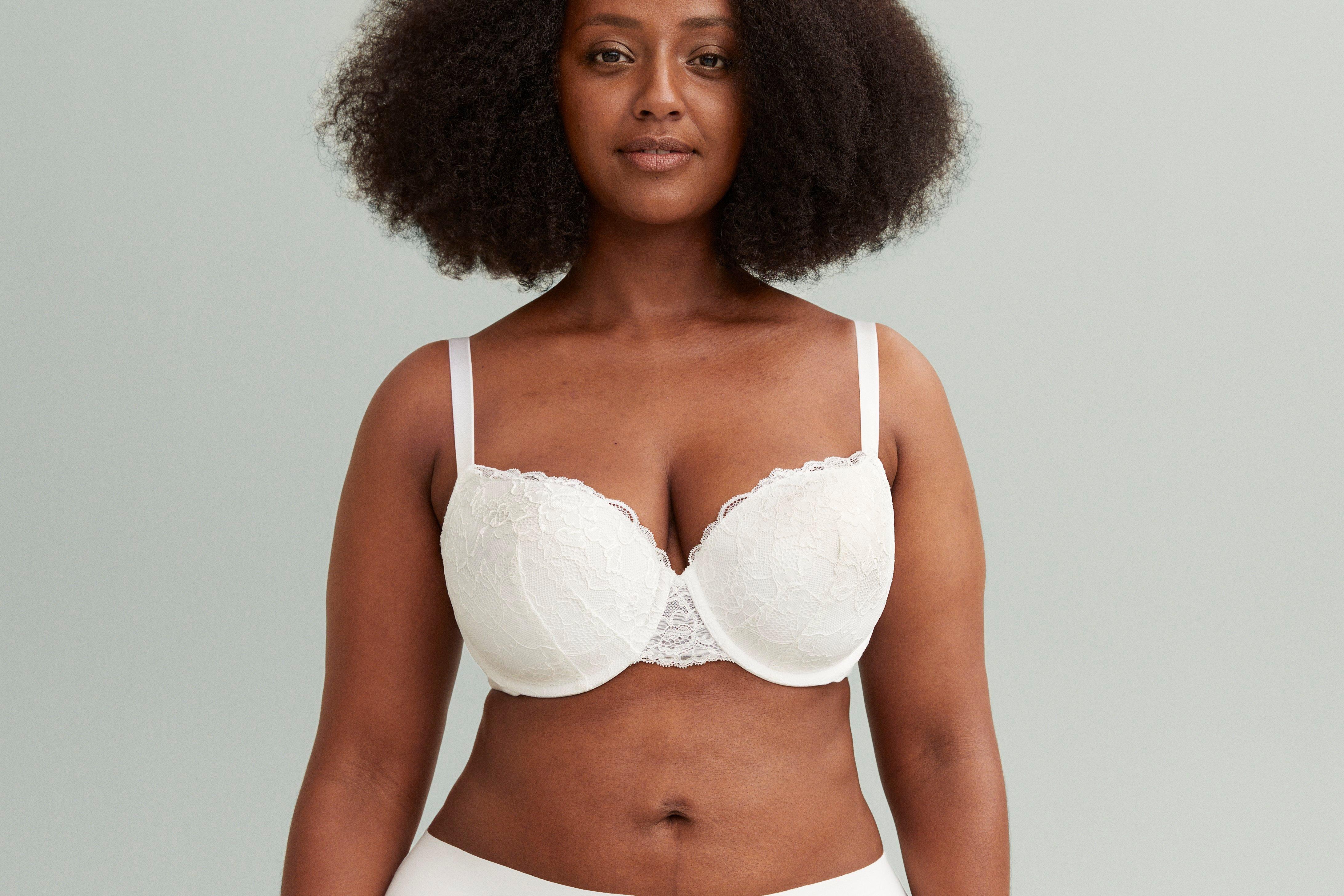 A woman in a white Akleja bra.