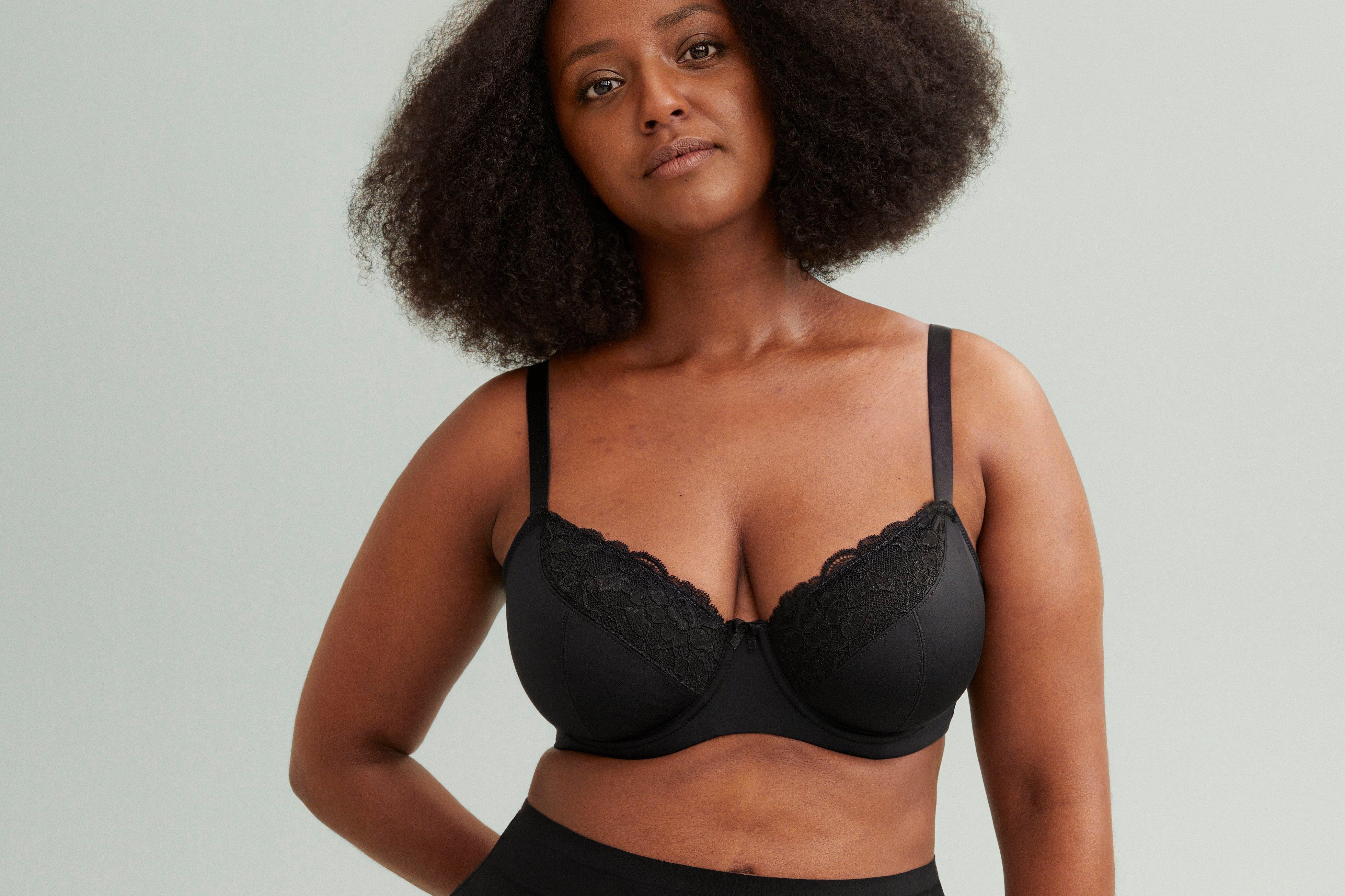 A woman in a black Aster bra.