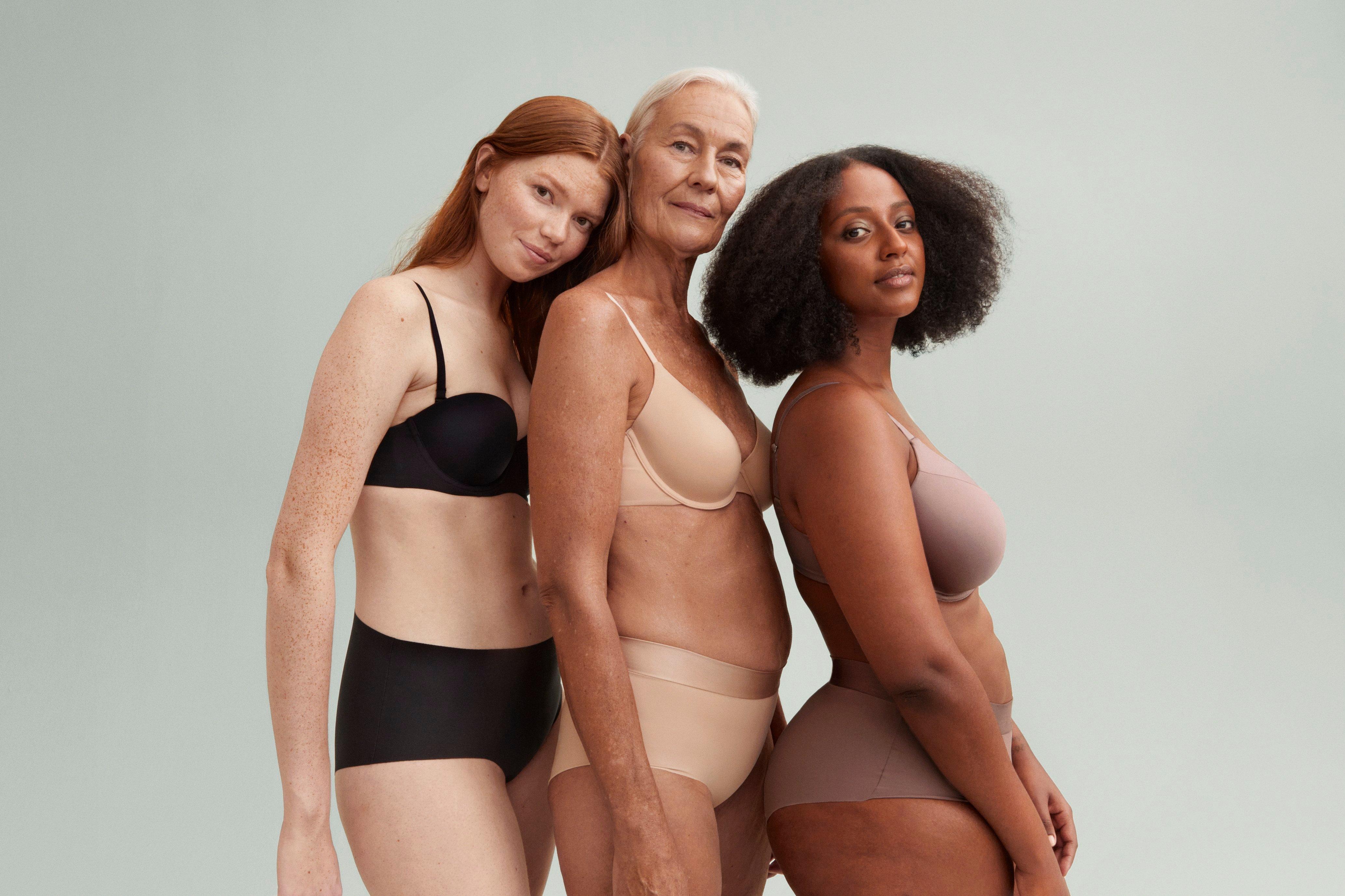 3 women standing together in bras and briefs