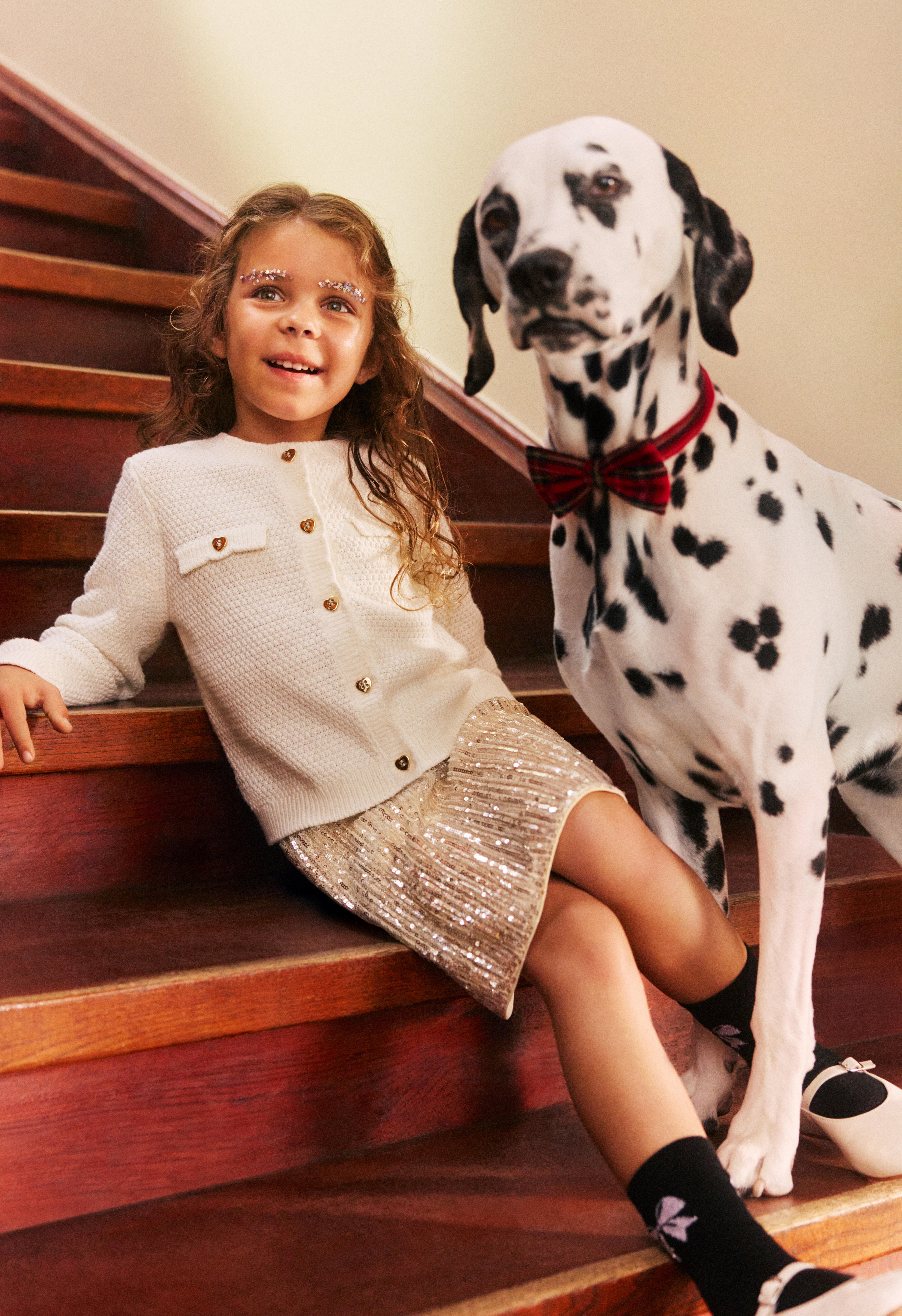 Girl in partywear with a dog