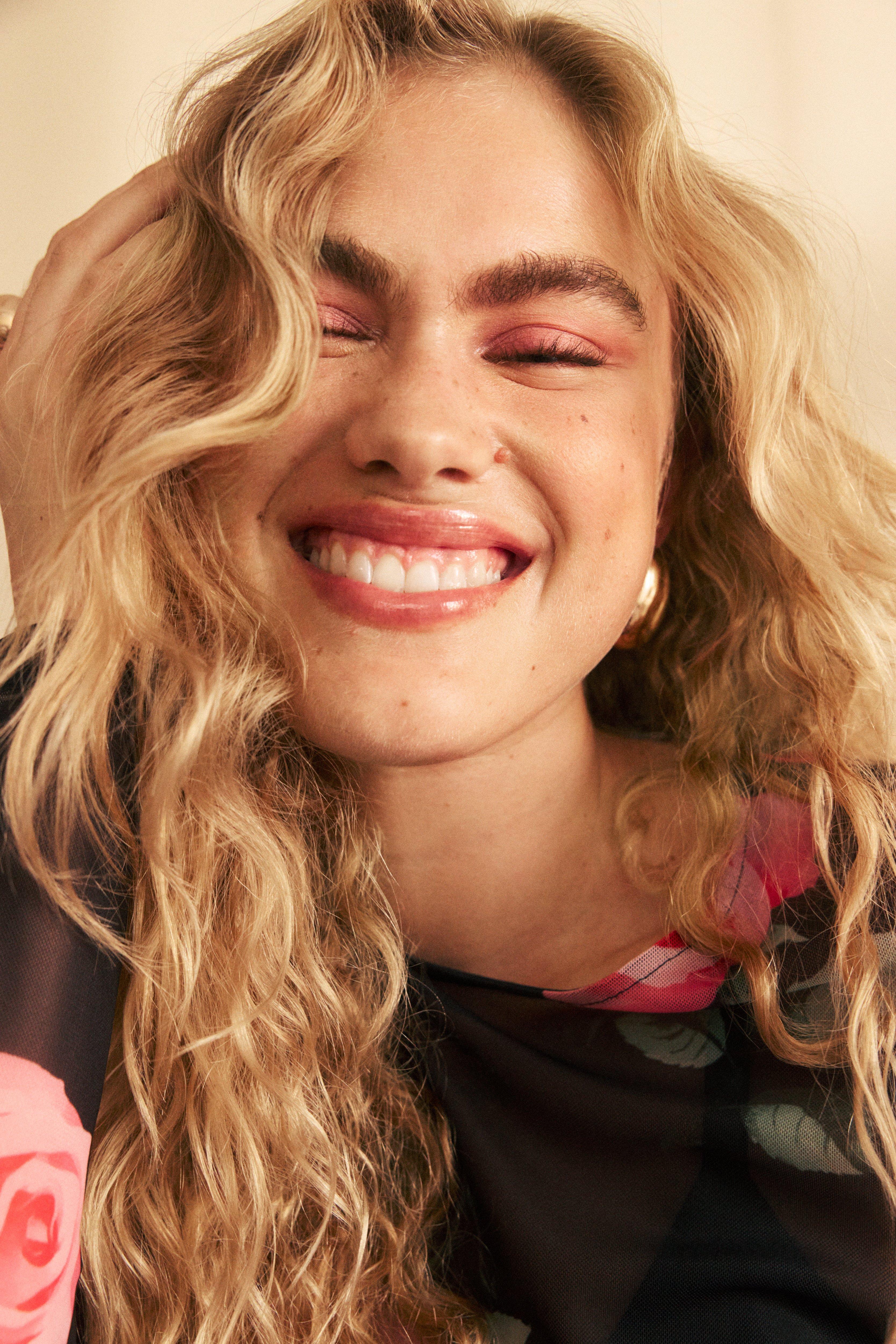 A blond woman with party makeup.