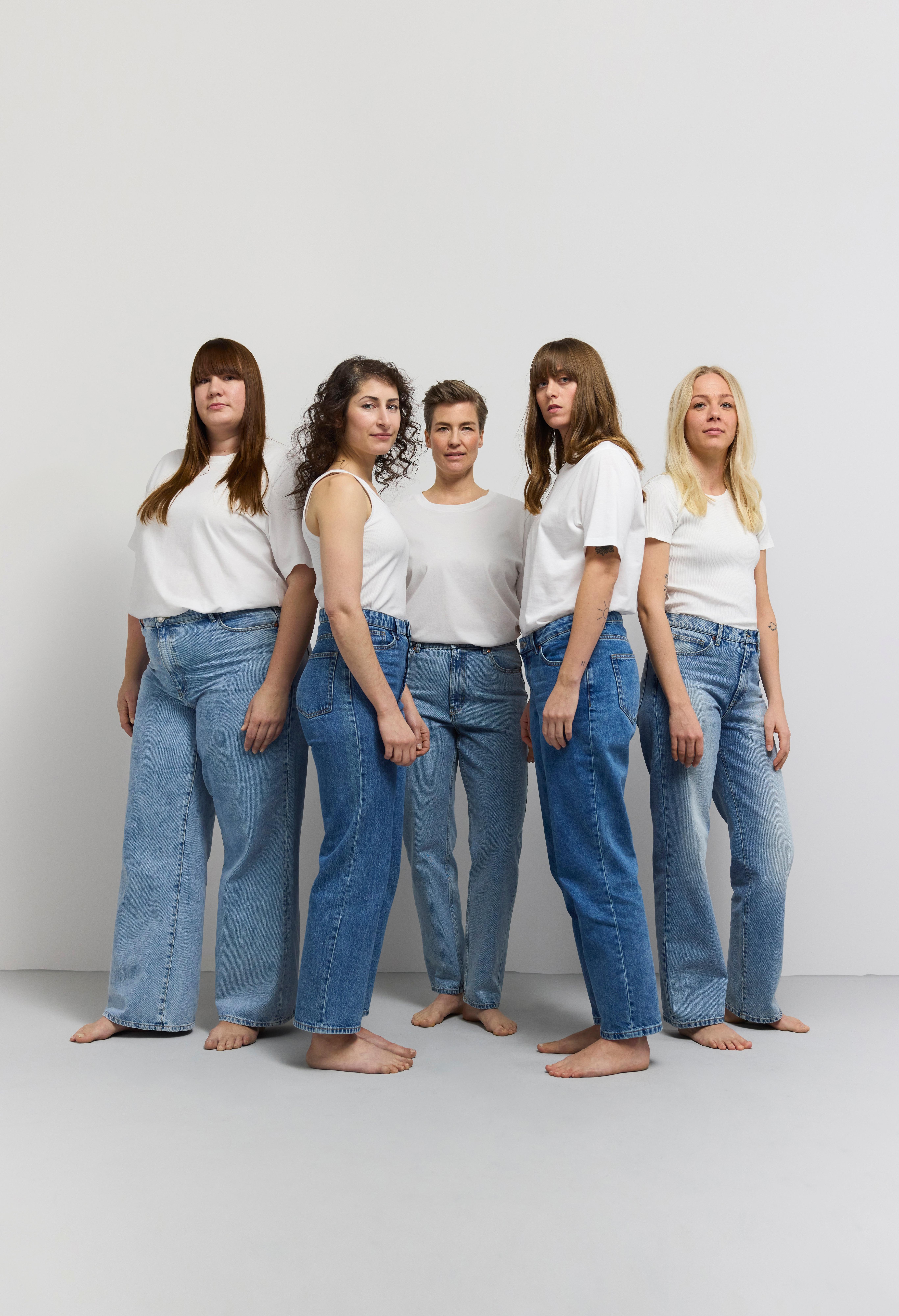  A group of women wearing jeans and white t-shirts from Lindex.