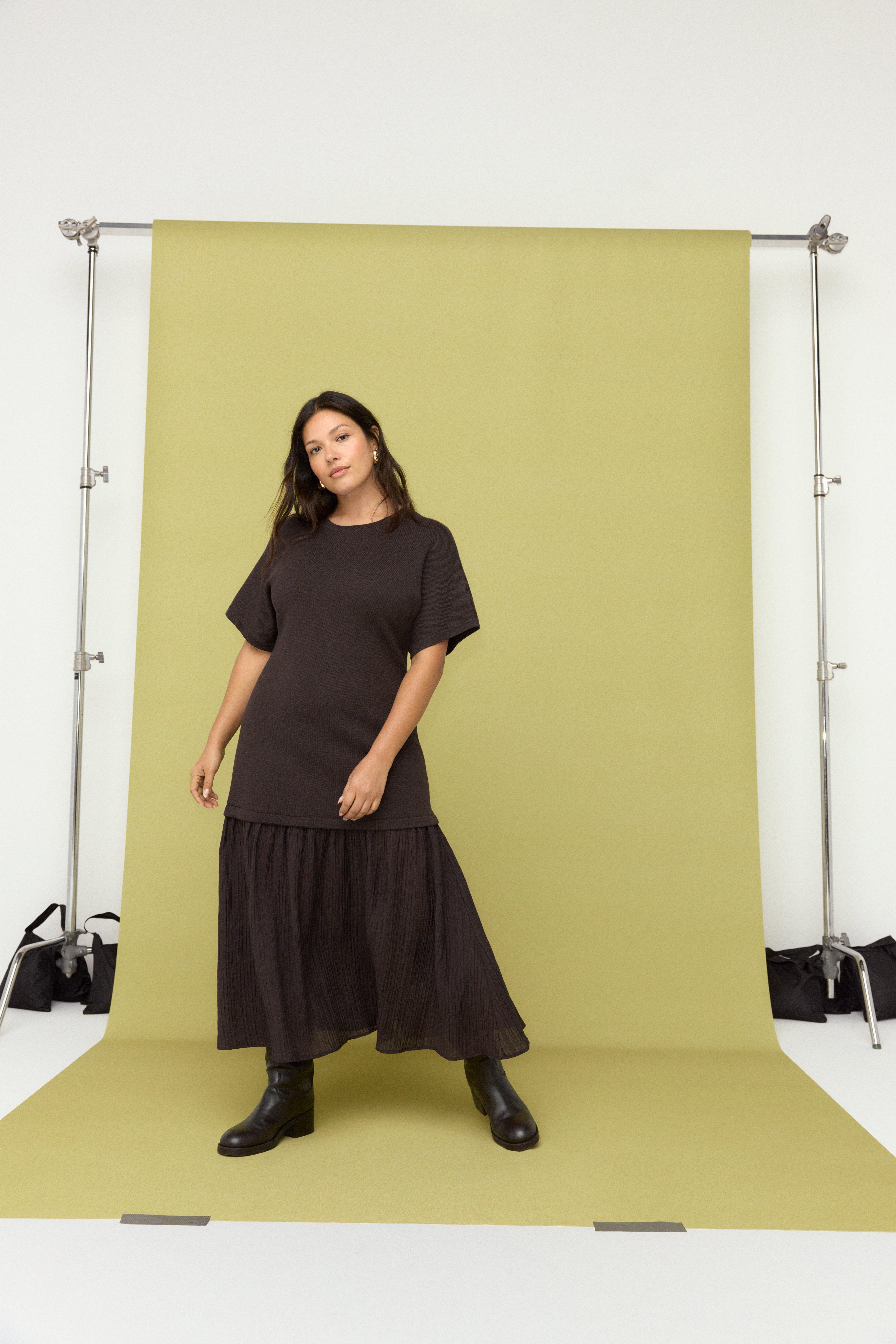 Woman in dark skirt and t-shirt