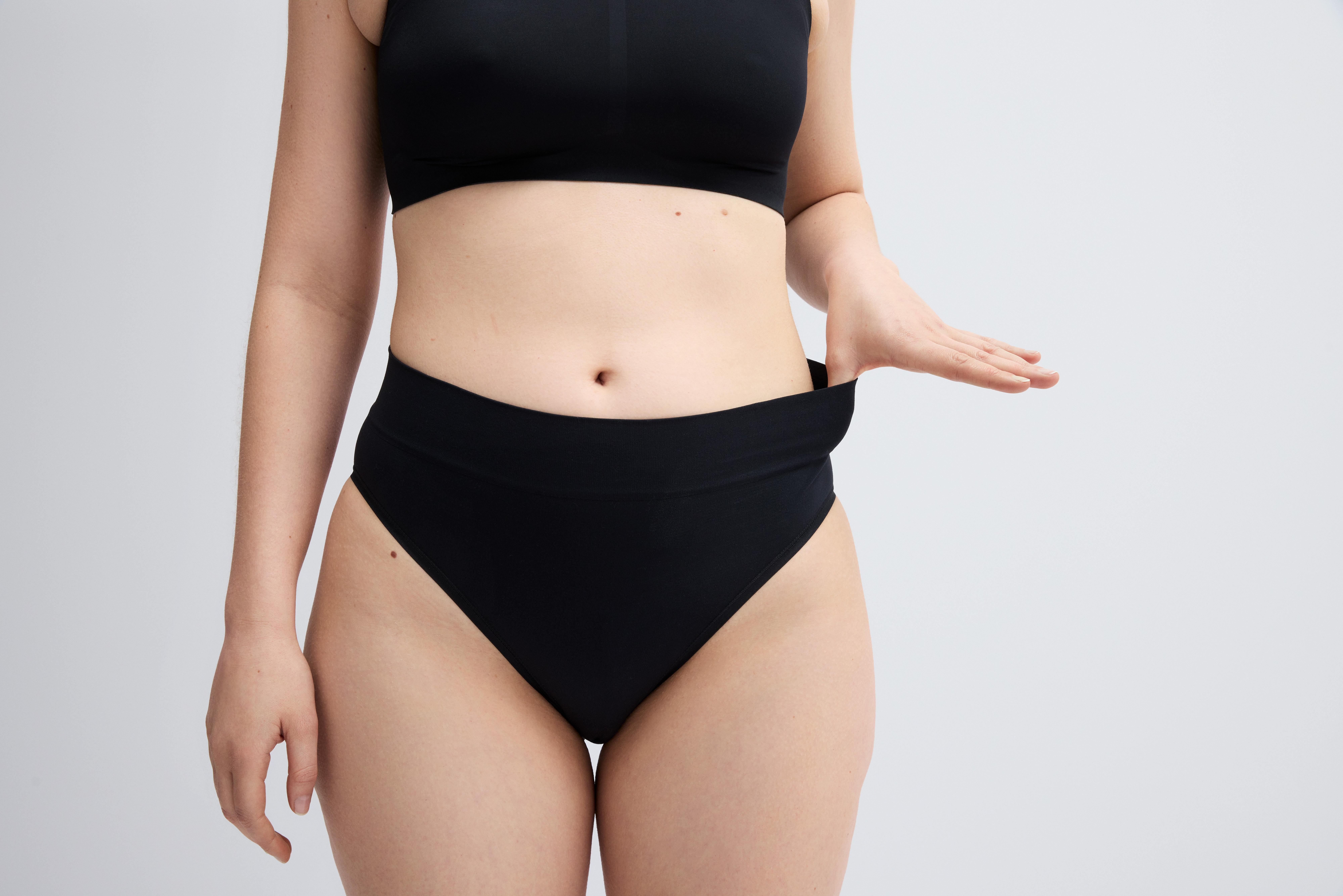 A woman in a pair of black knickers.