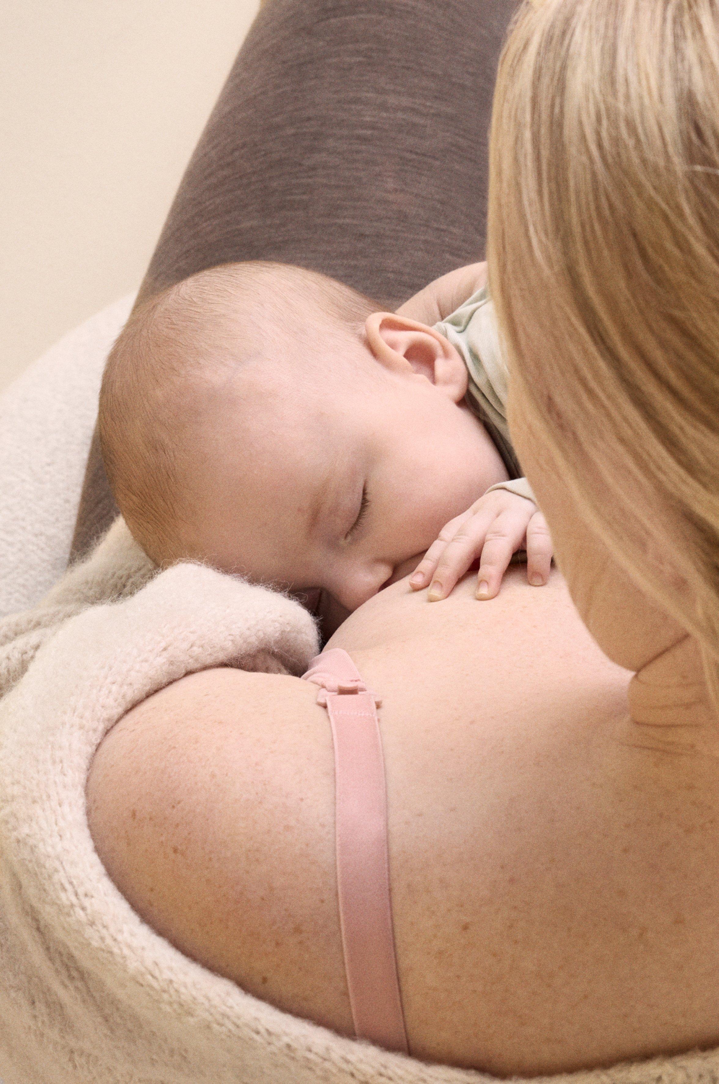 A mom breastfeeding her baby.