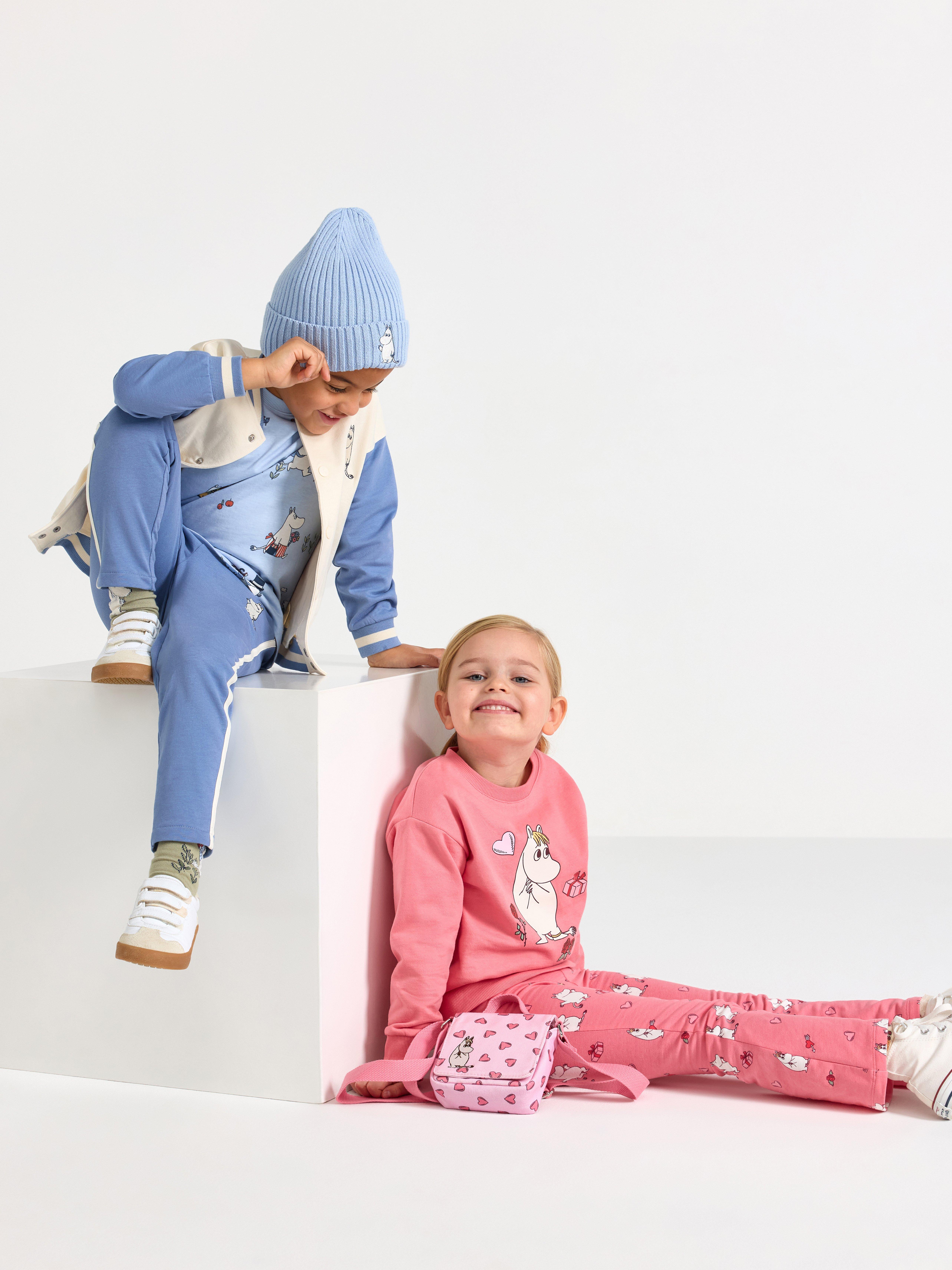 Kids clothes with mumin print and hearts 