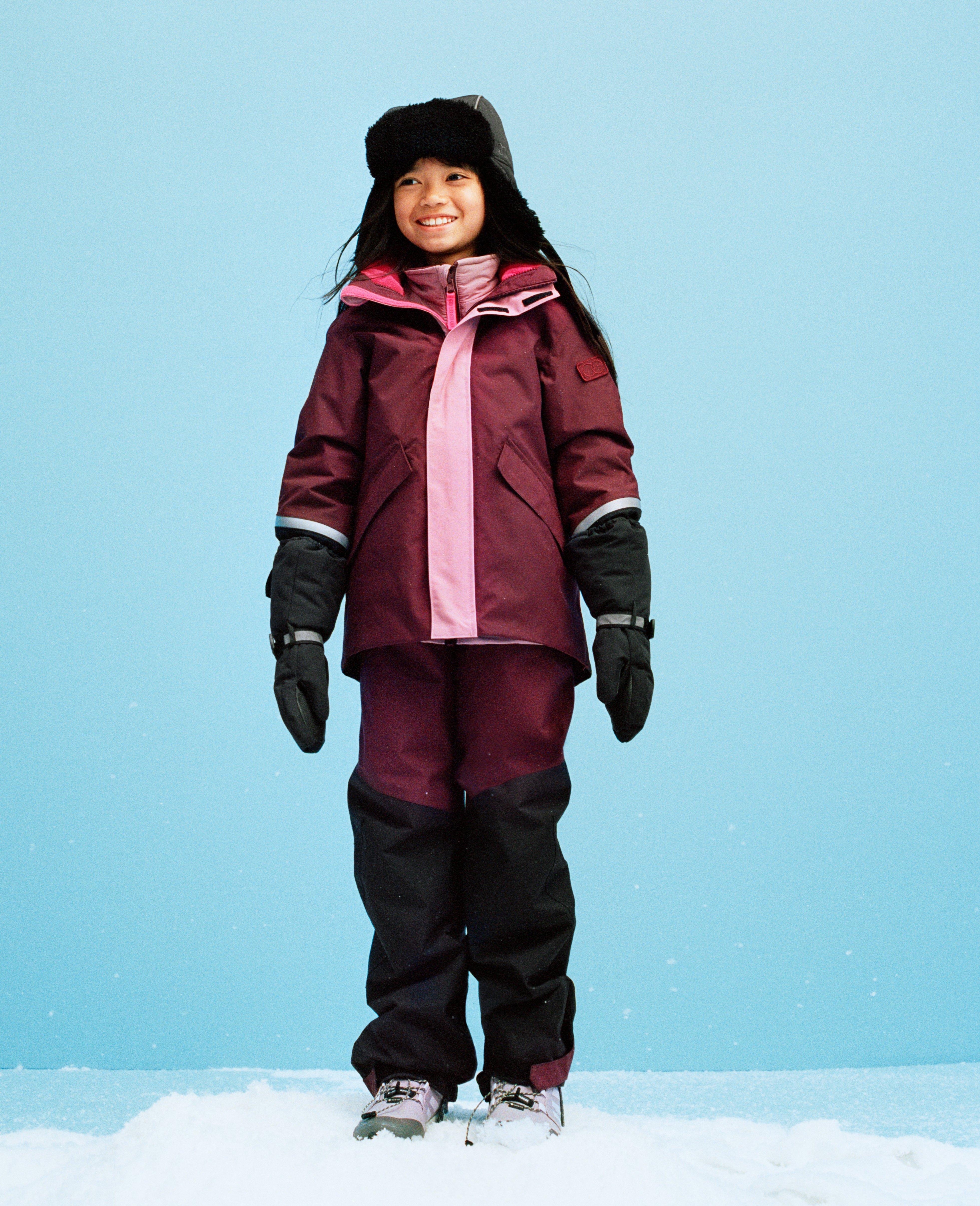 Girl in dressed in the new Lindex Kids Performance Wear shell set.