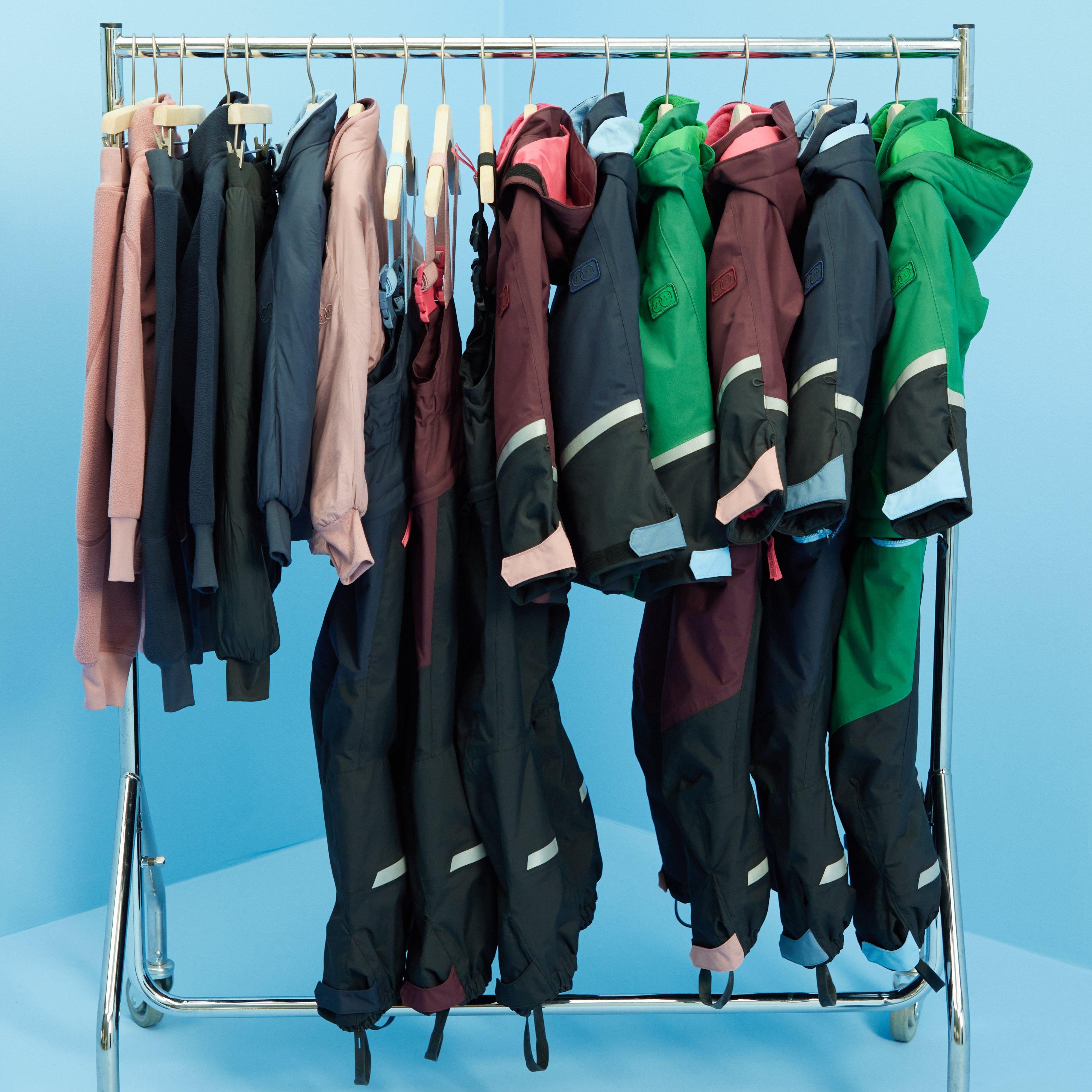 A clothing rack with several items from Kids Performance Wear from Lindex.