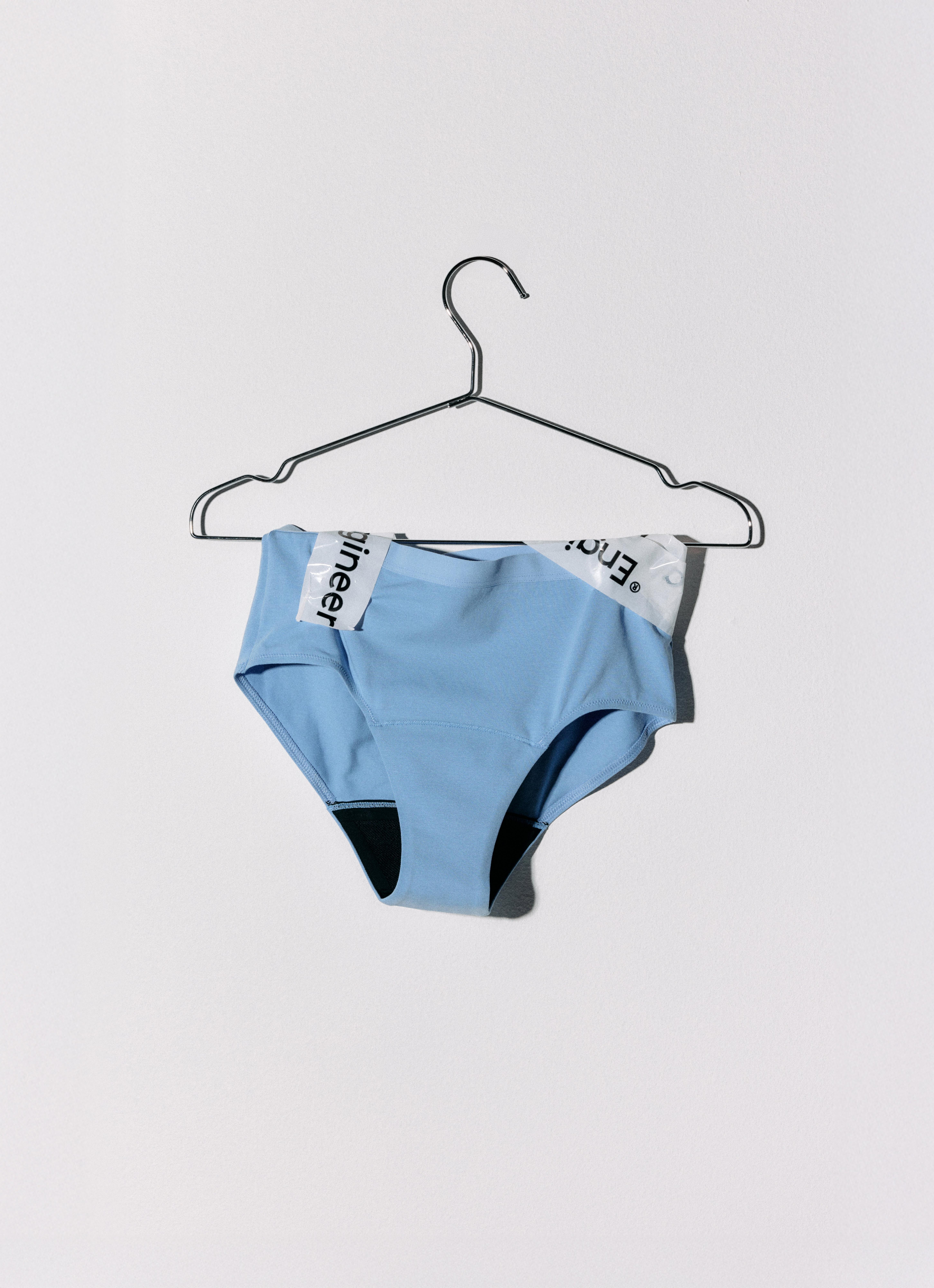 Period panties hanging on a hanger.