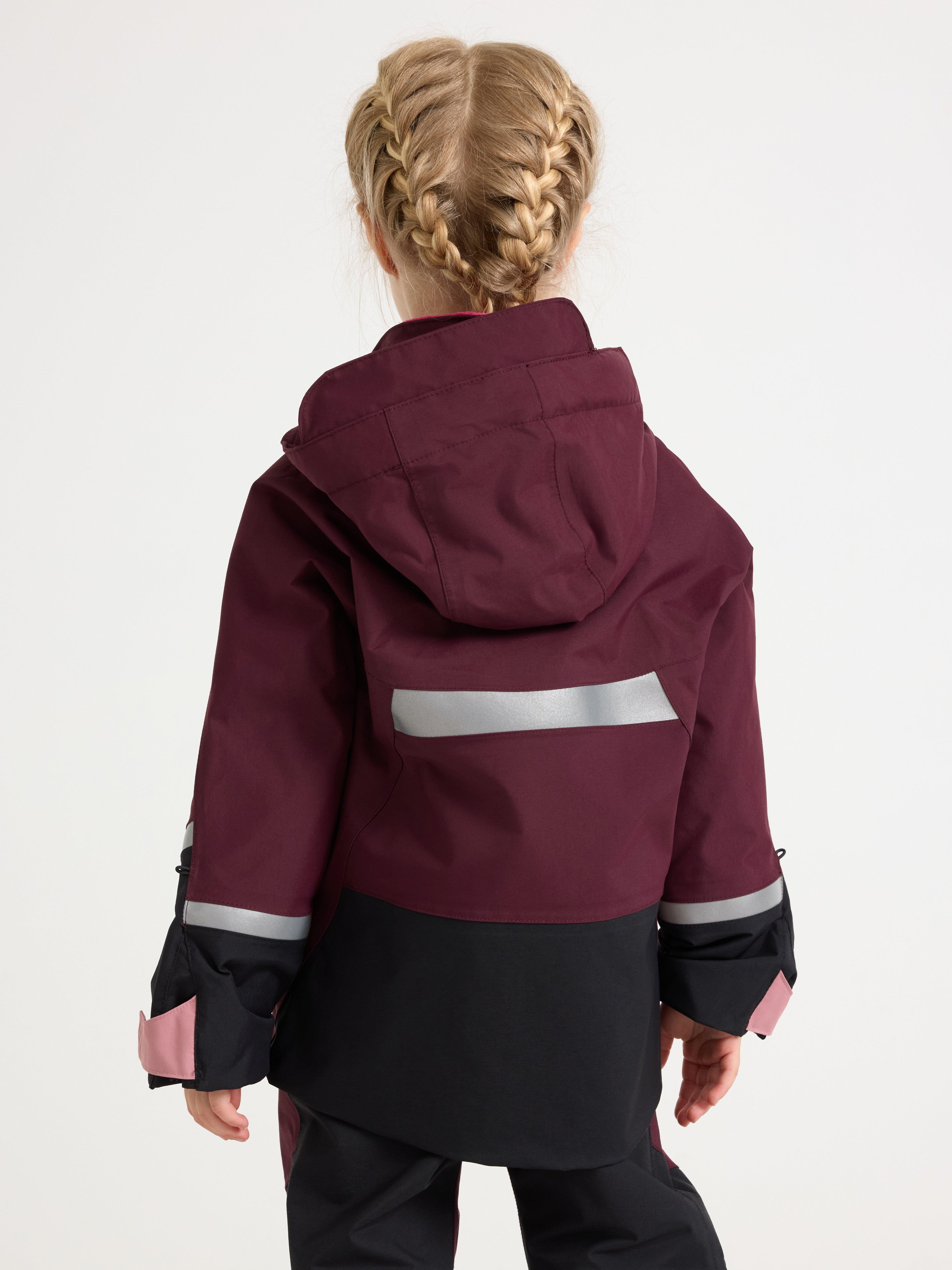 A girl in a purple function jacket.