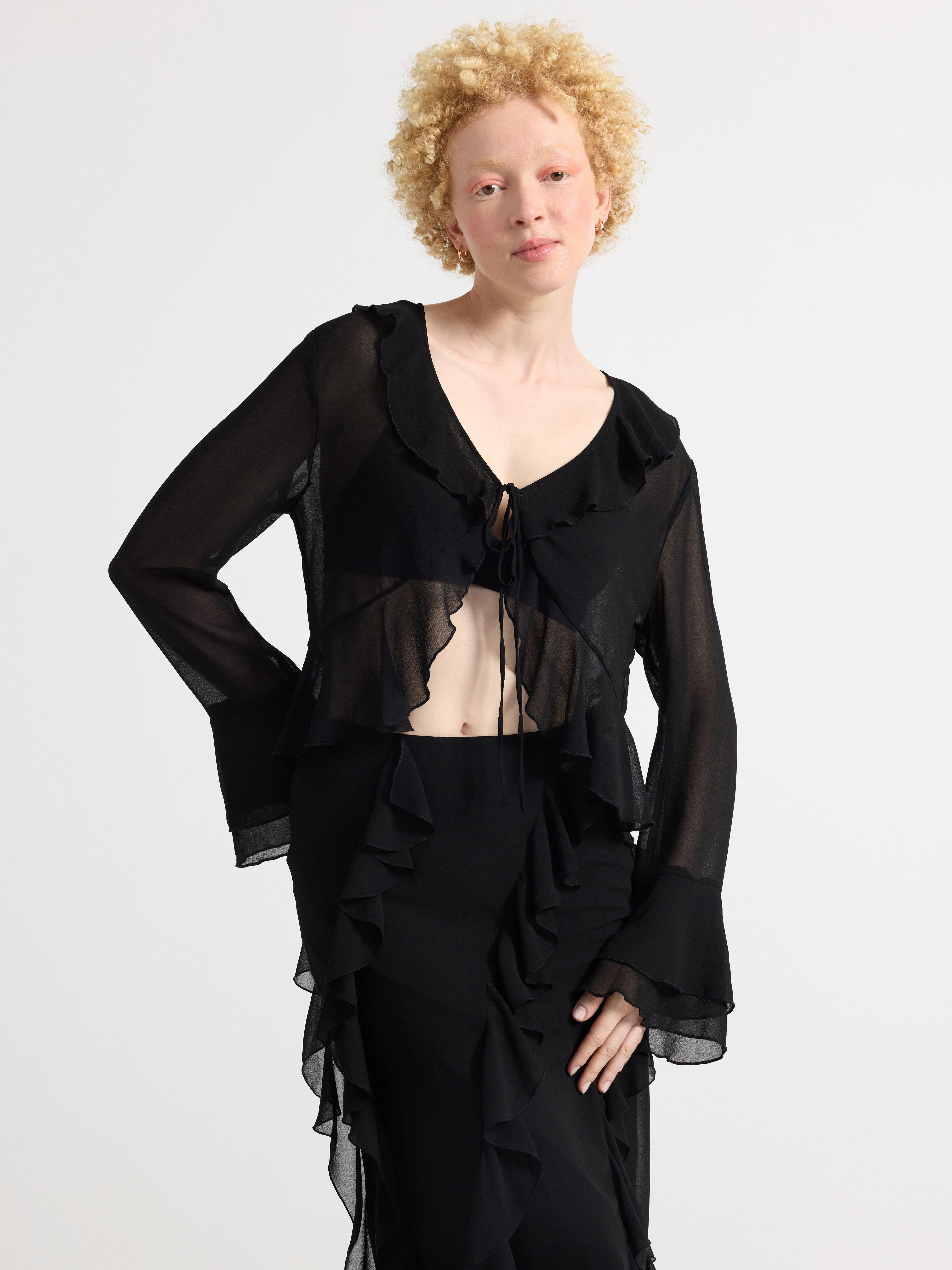 Blus med volanger