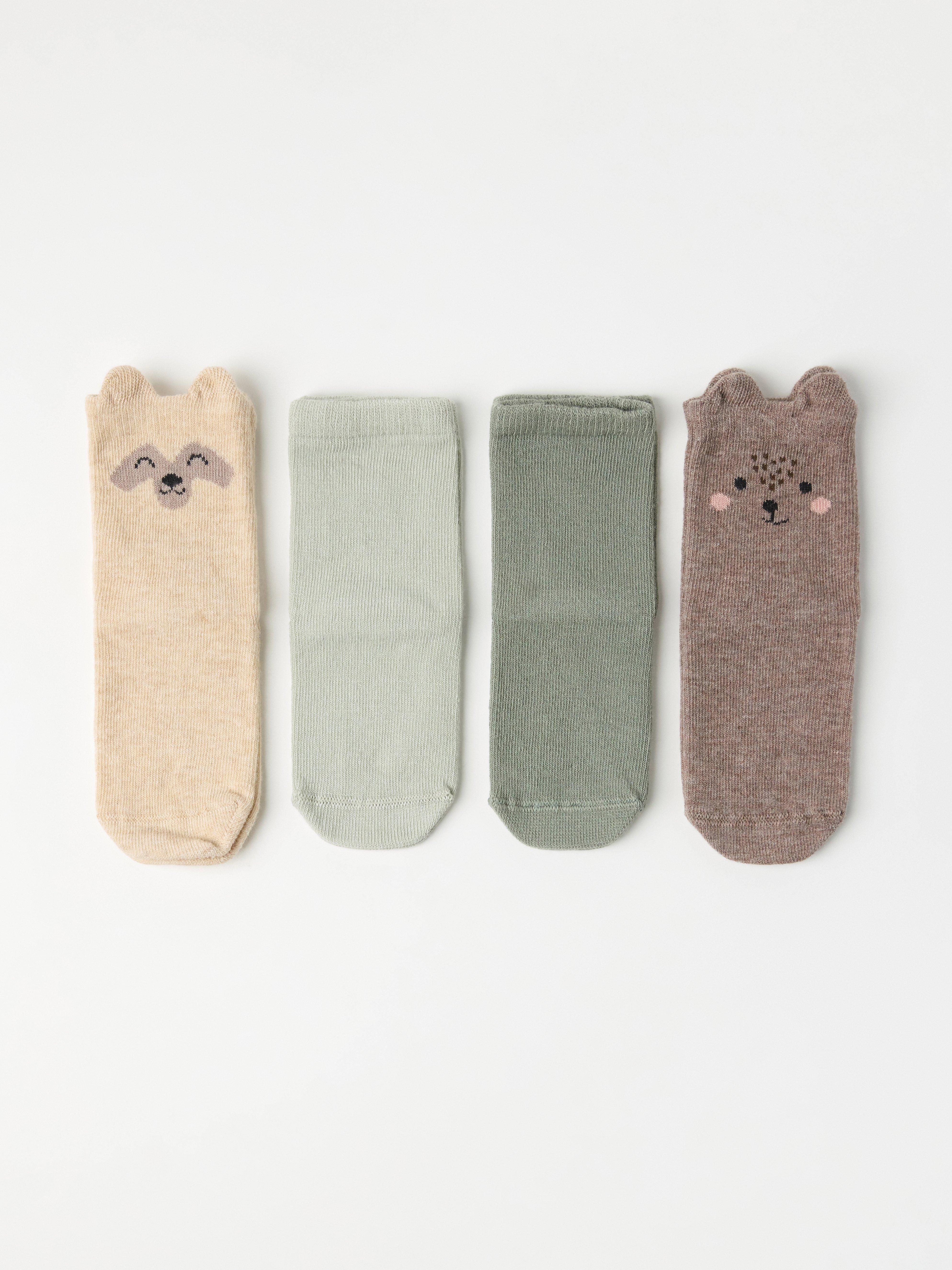 4 soft socks with forest animal motifs and solid colours.