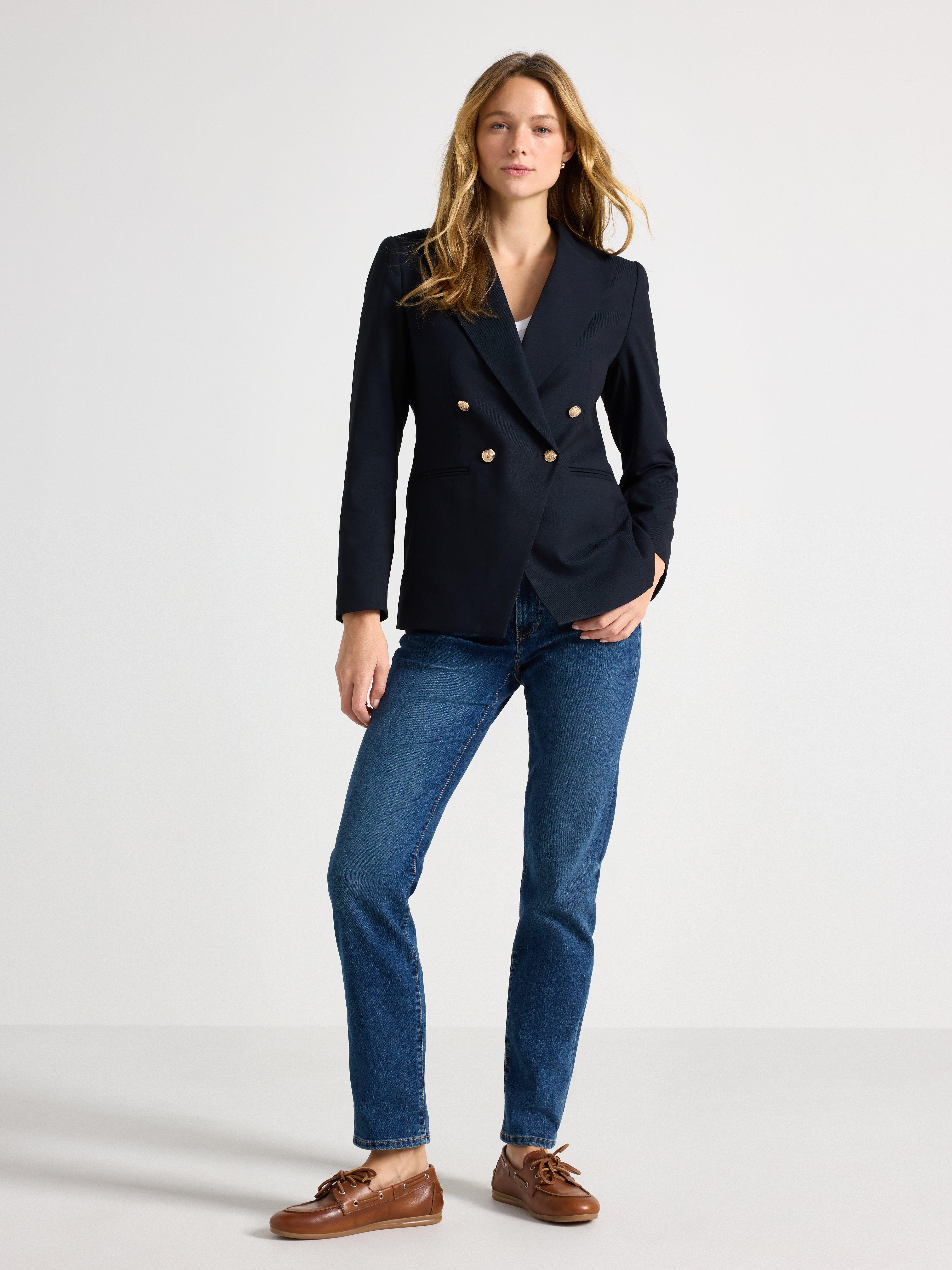 A woman in jeans and a jacket.