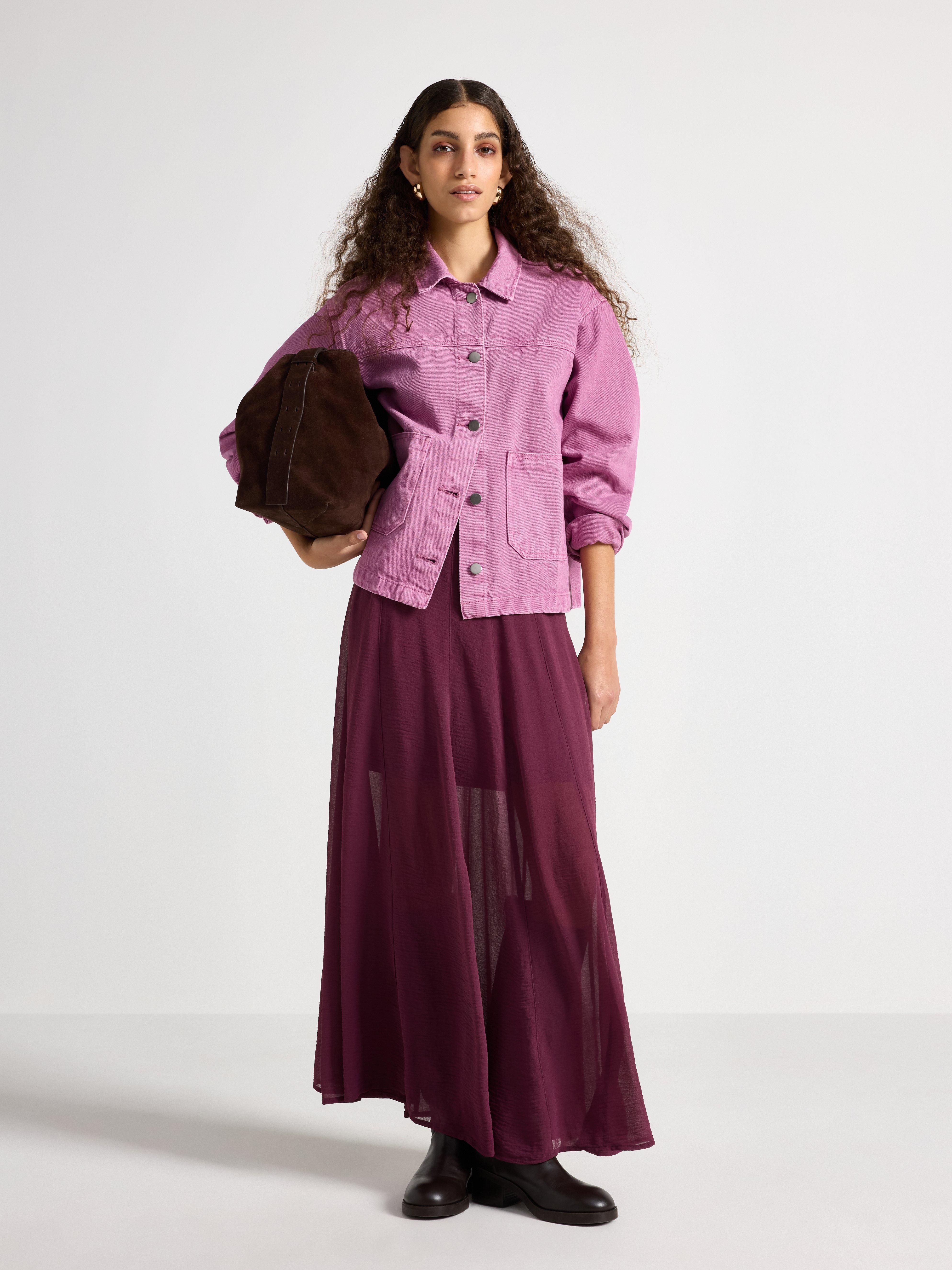 A woman dressed in a feminine style.