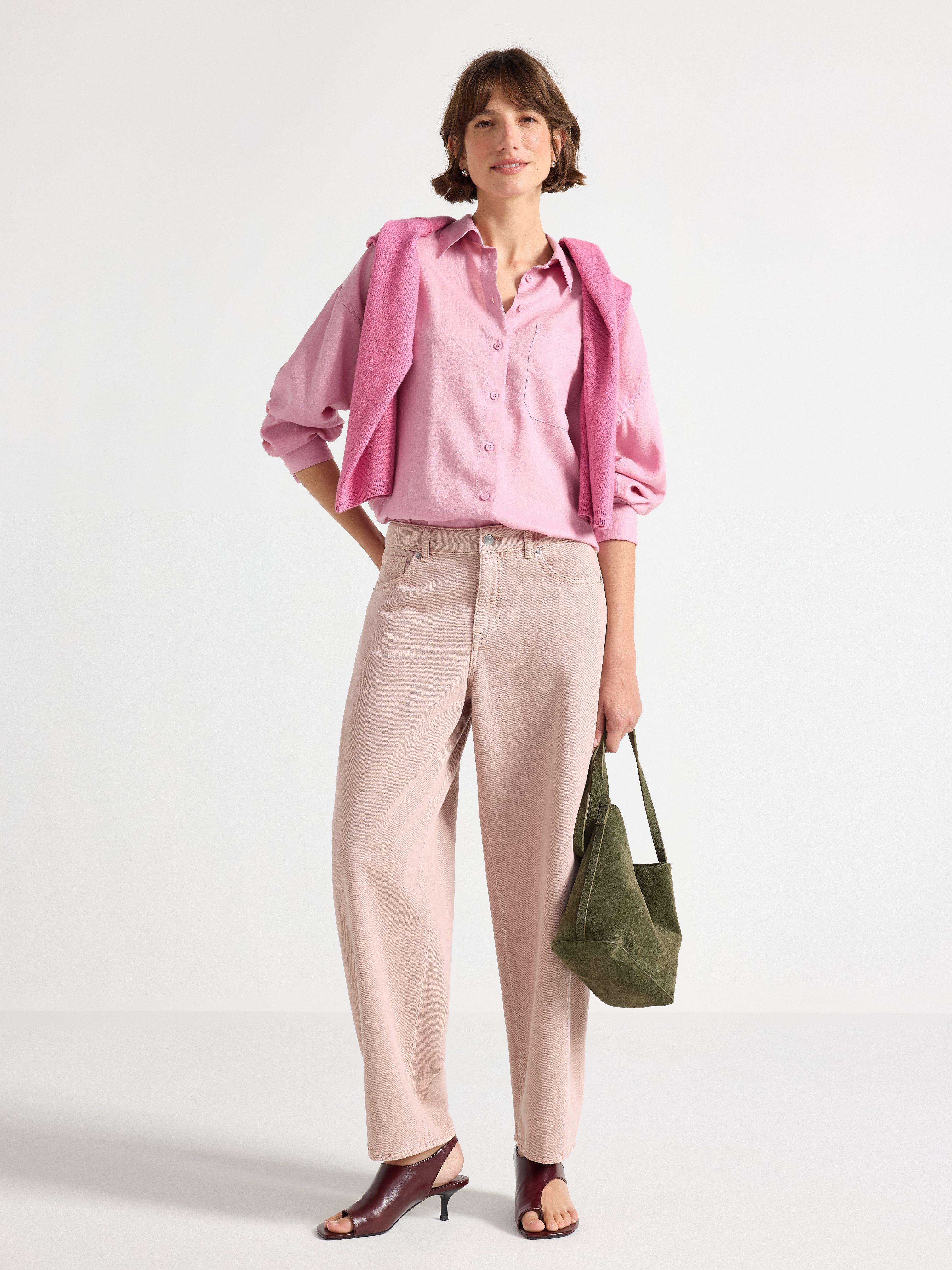 A woman dressed in a feminine style.