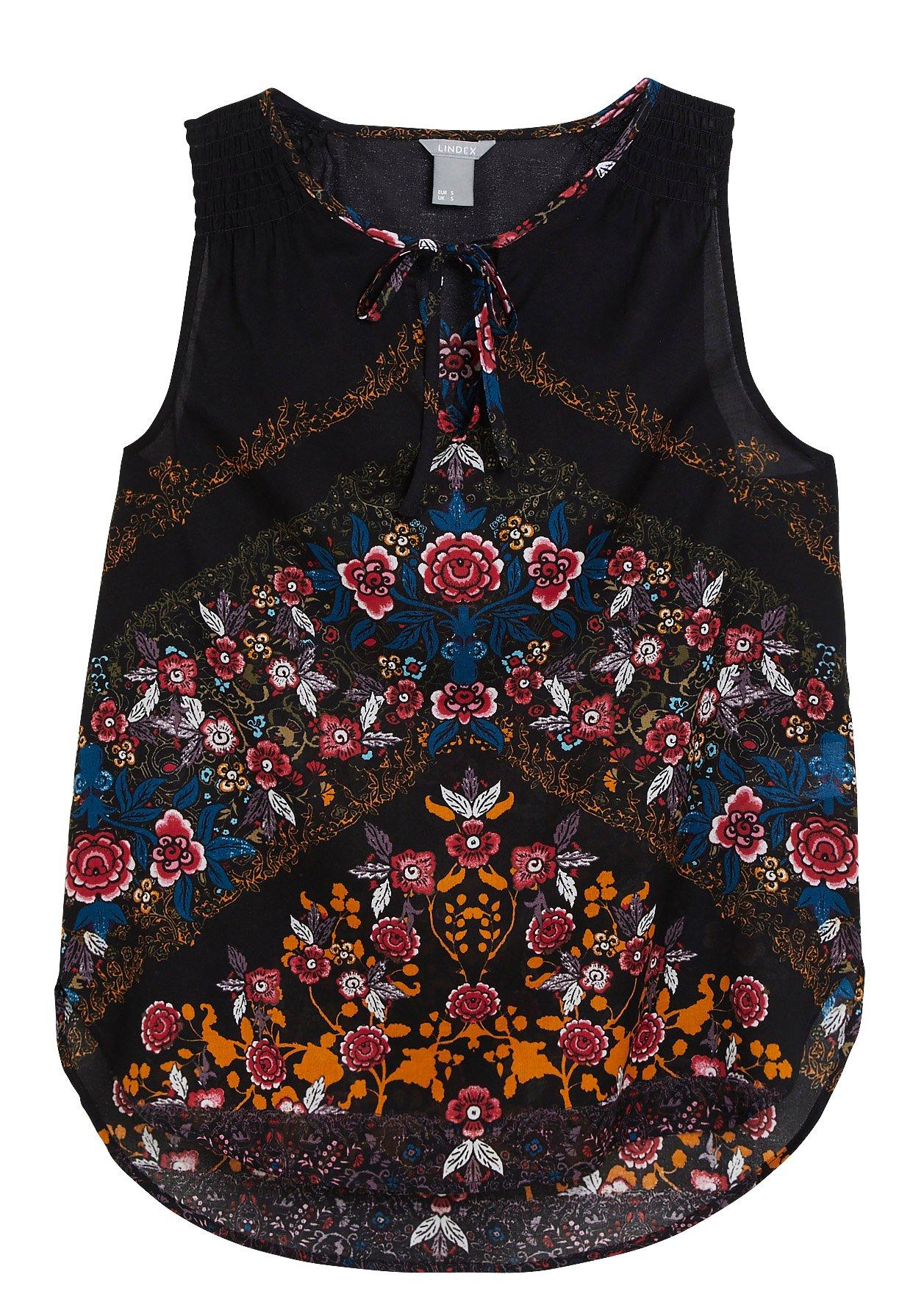 Ermeløs bluse i bomull