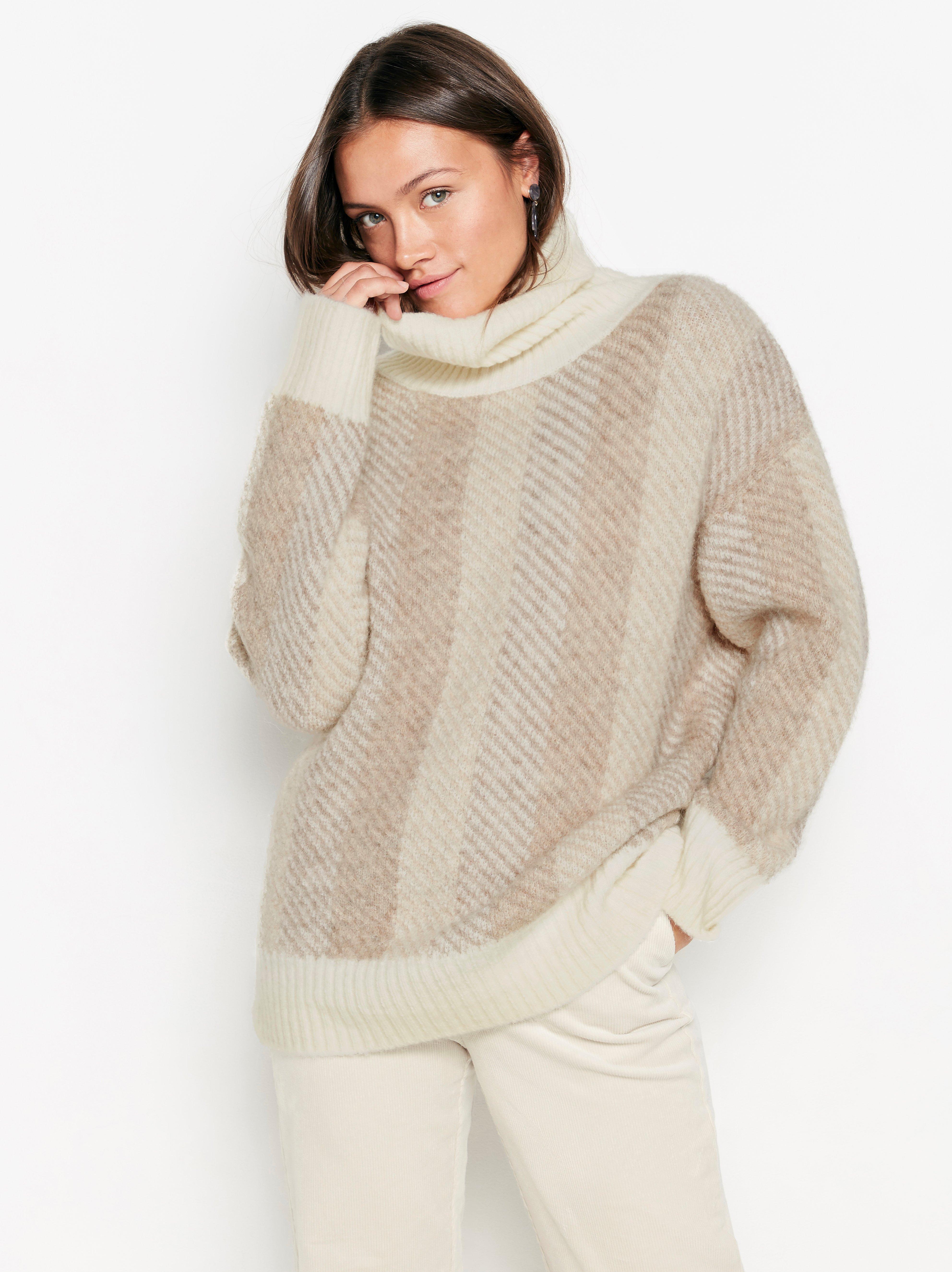 white knitted roll neck jumper