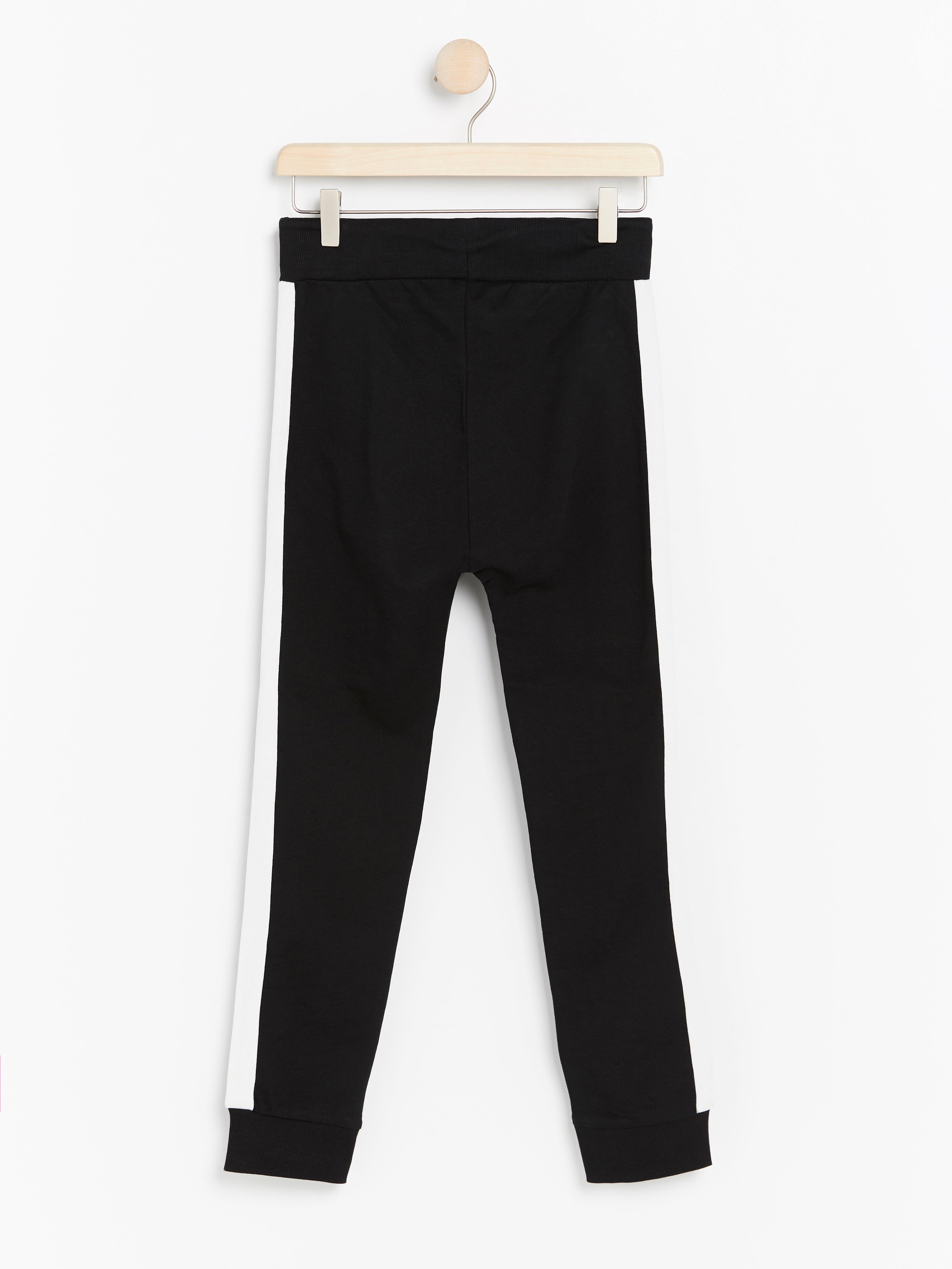 black sweatpants with white stripe