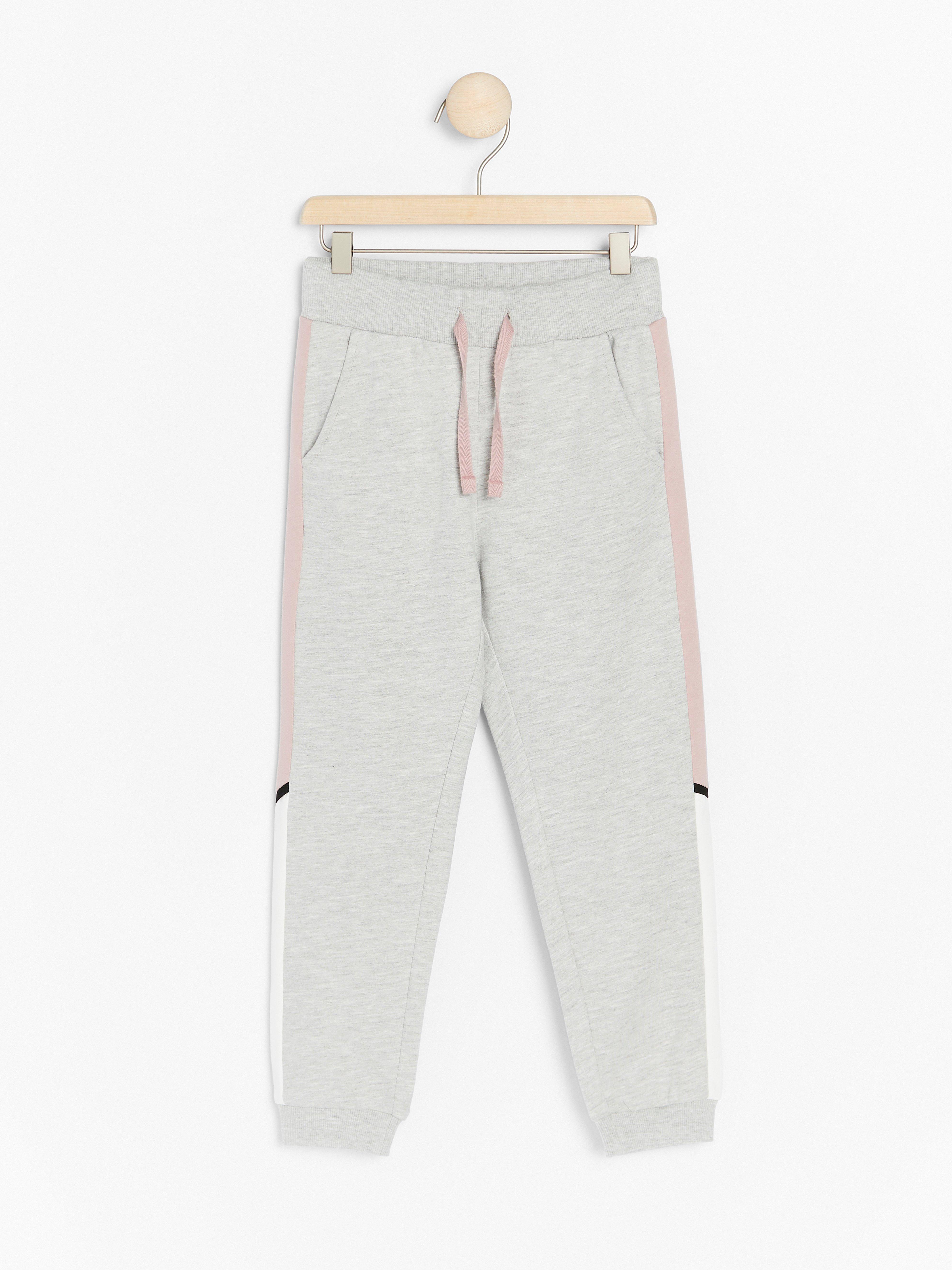 grey sweatpants with white stripe