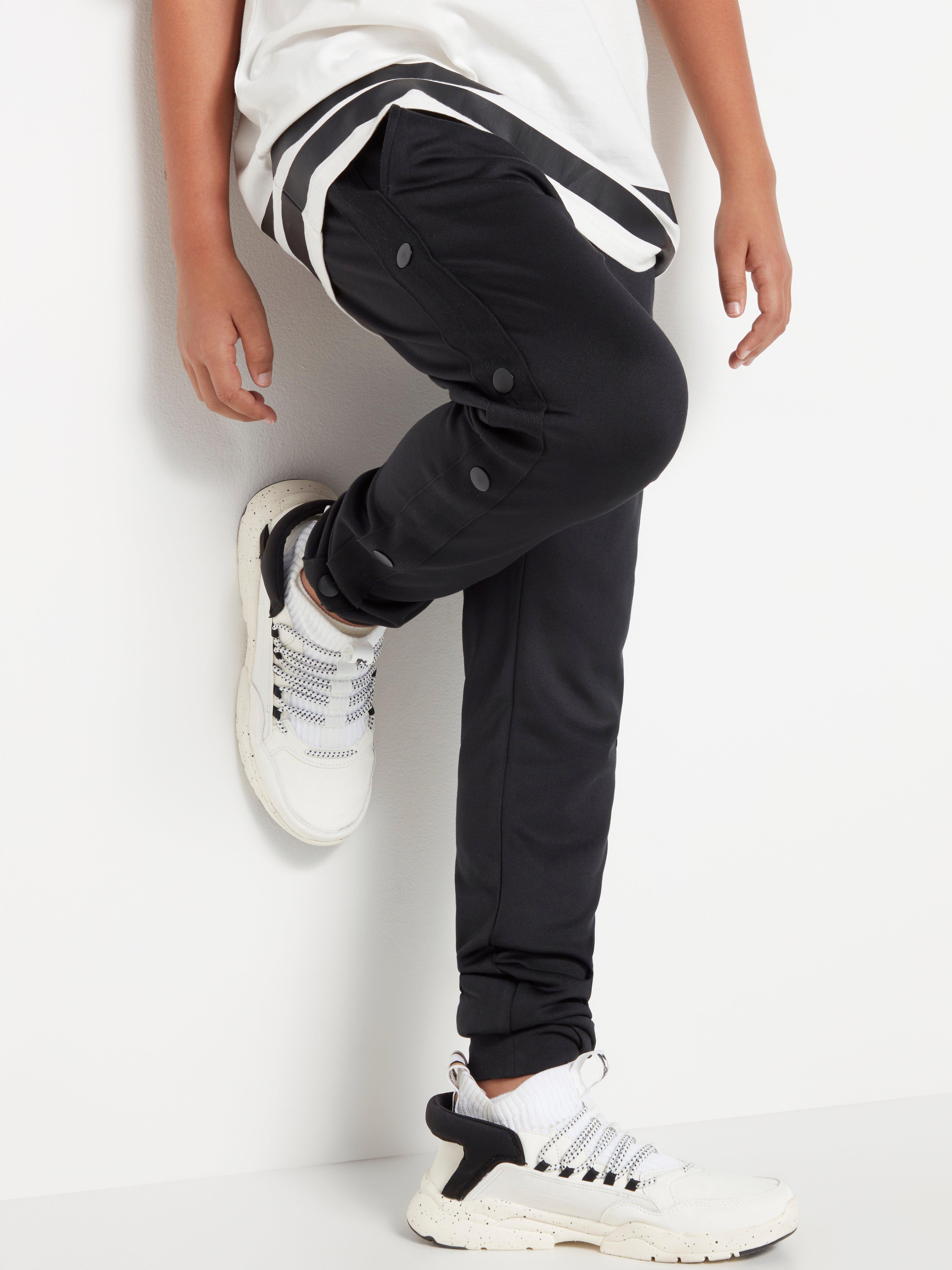 track pants with side buttons