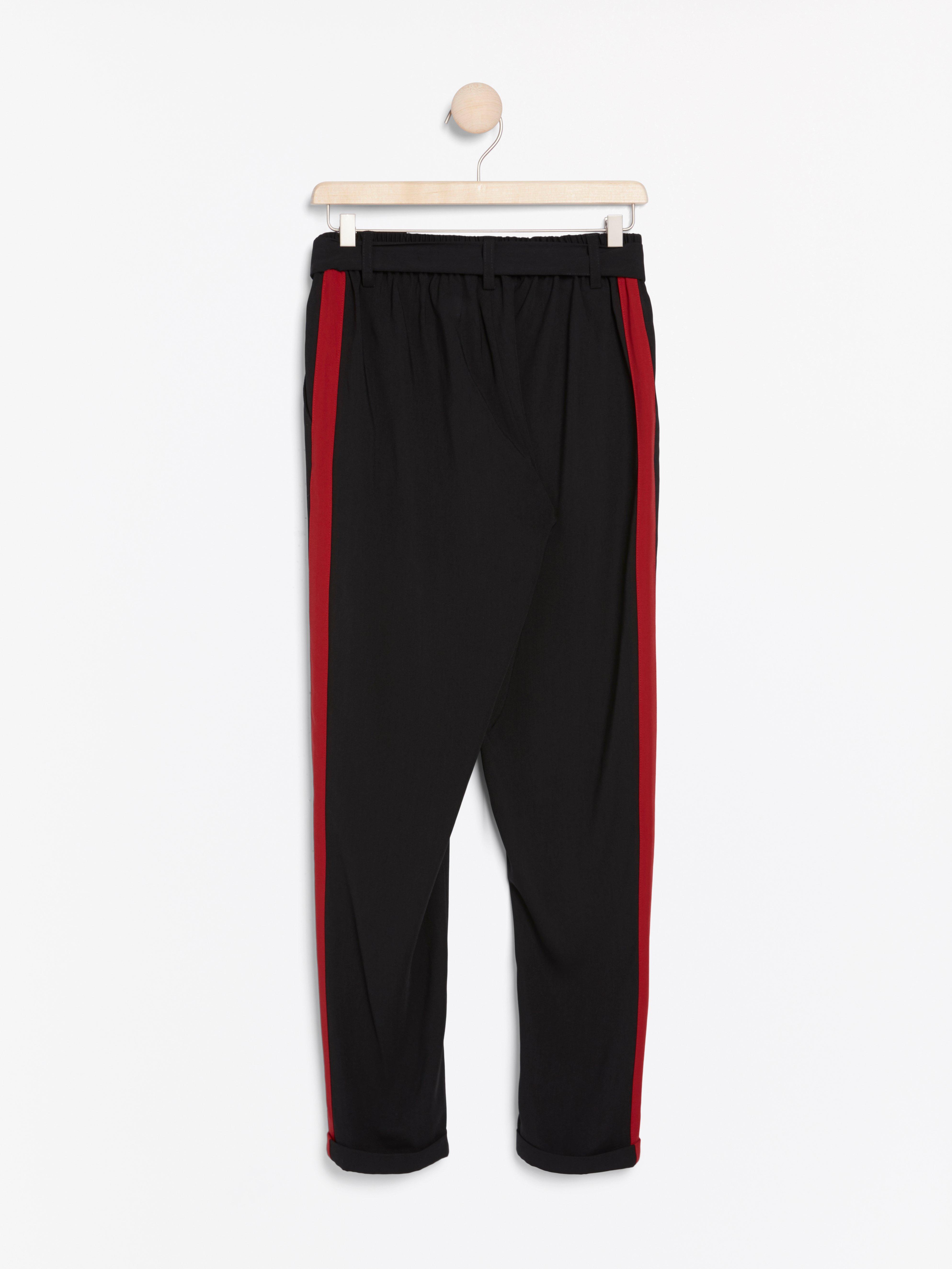 black trousers red side stripe