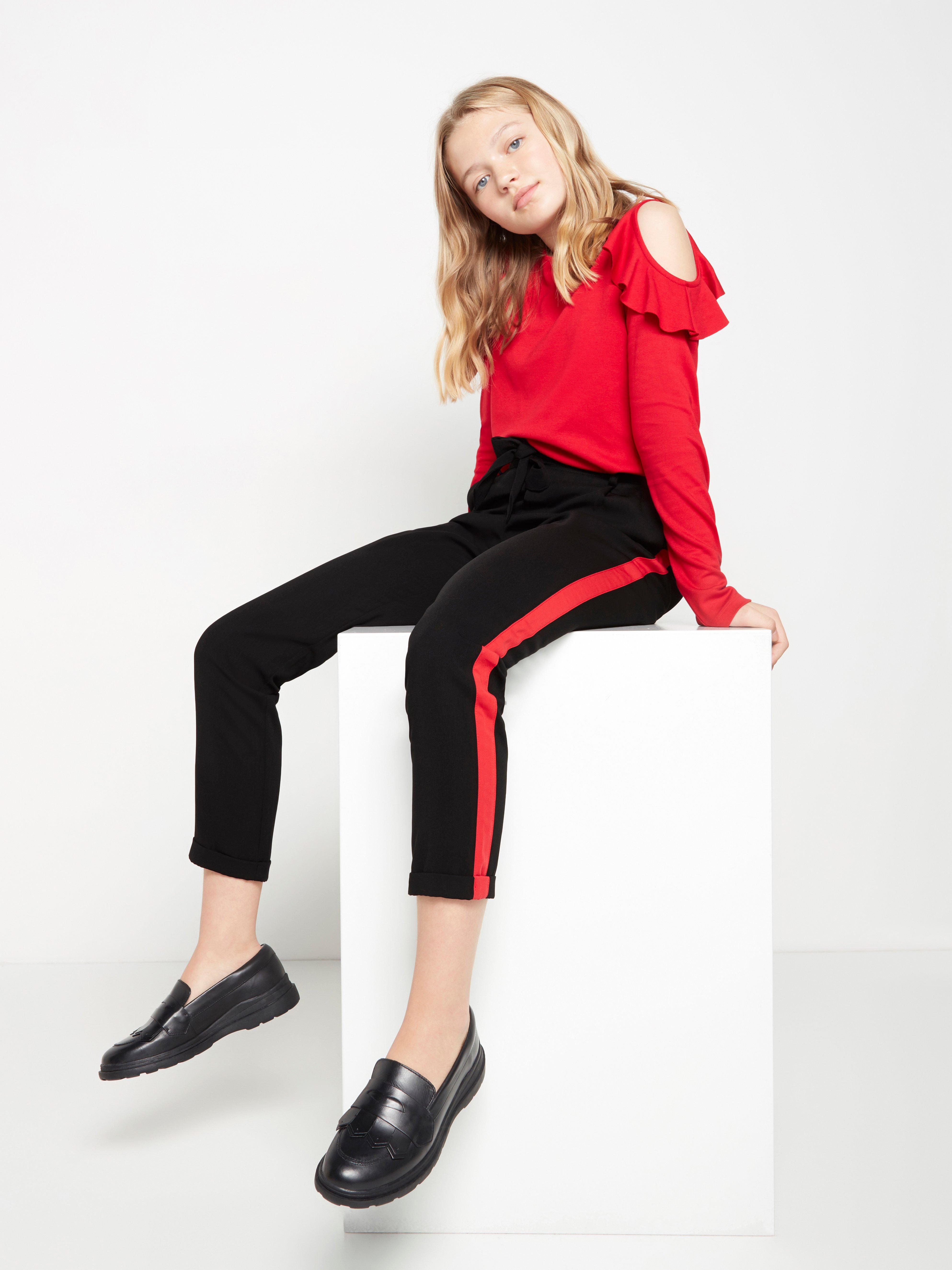 Loose fit black trousers with red side stripes Lindex