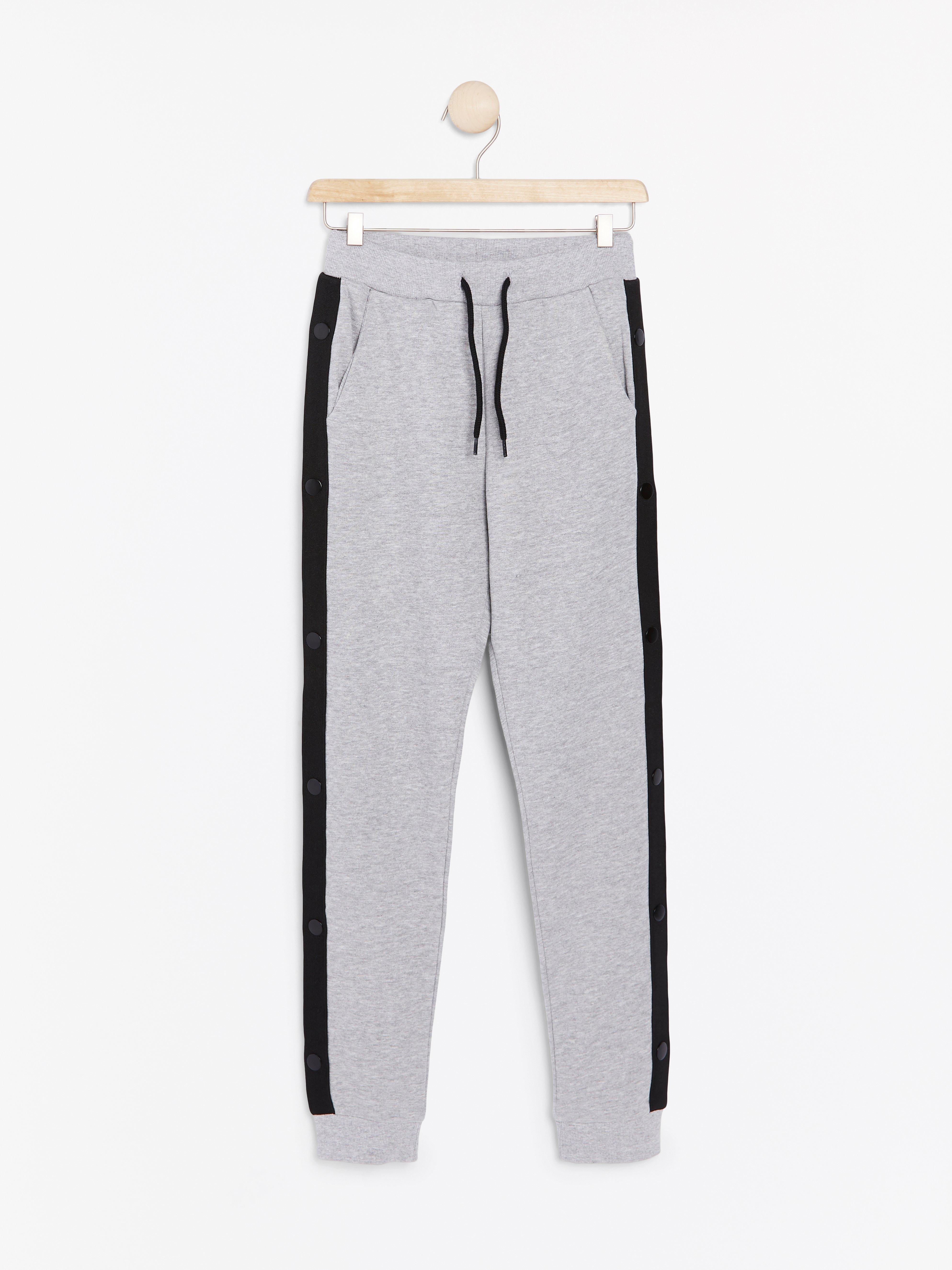 grey sweatpants with white stripe