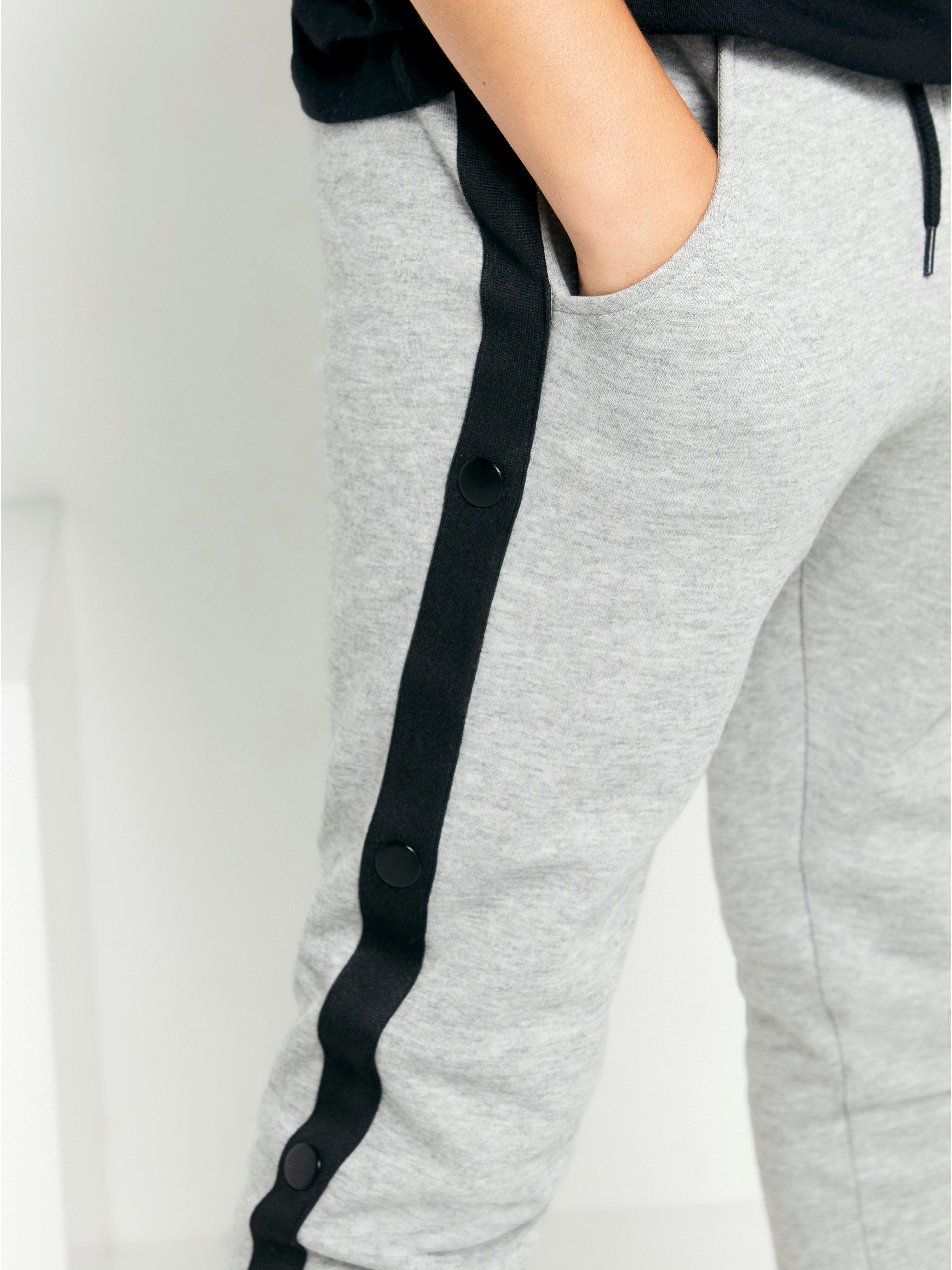 Grey joggers with black stripe sale