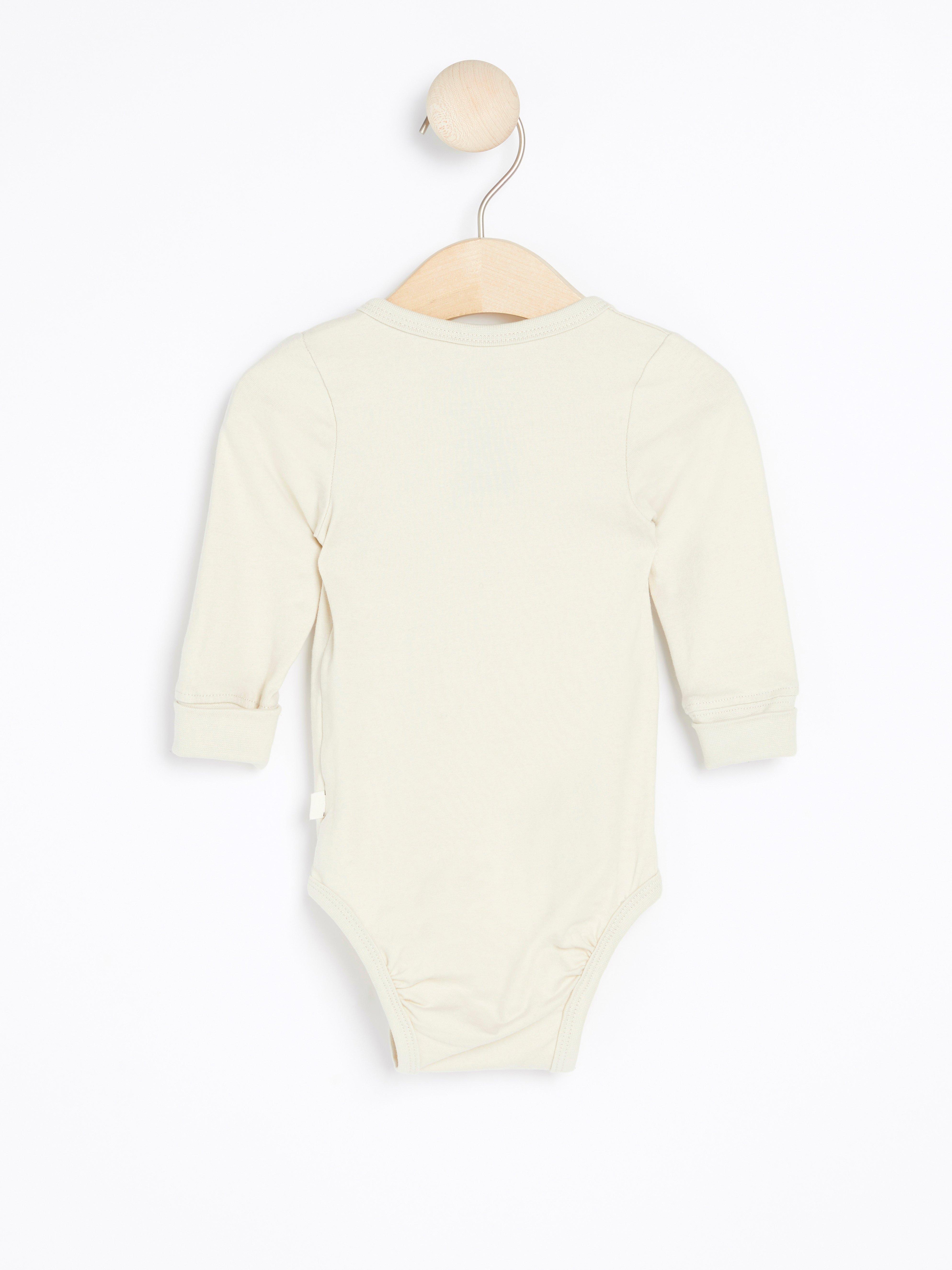 Wrap long sleeve bodysuit with print