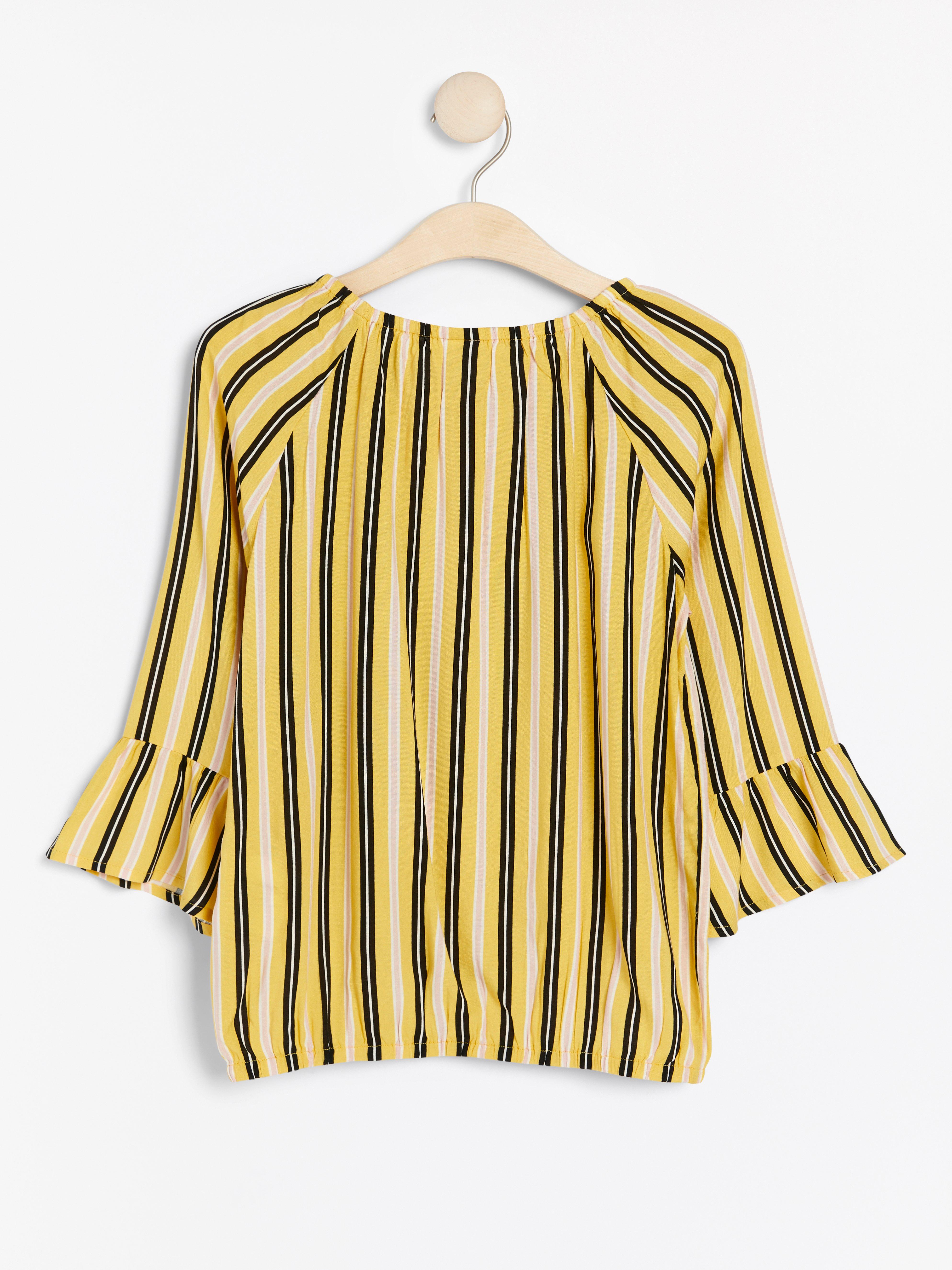 yellow patterned blouse