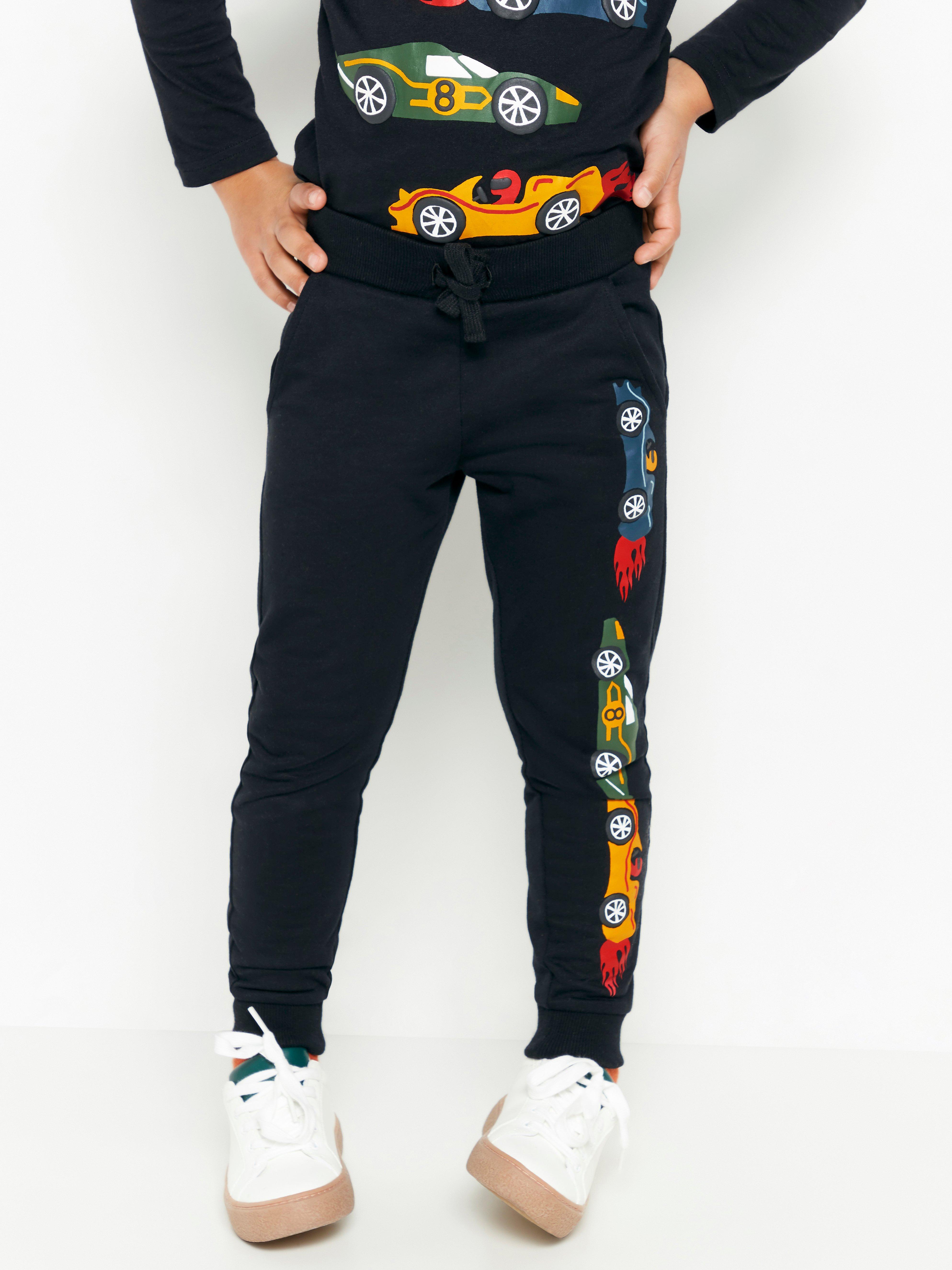 Black sweatpants with race cars