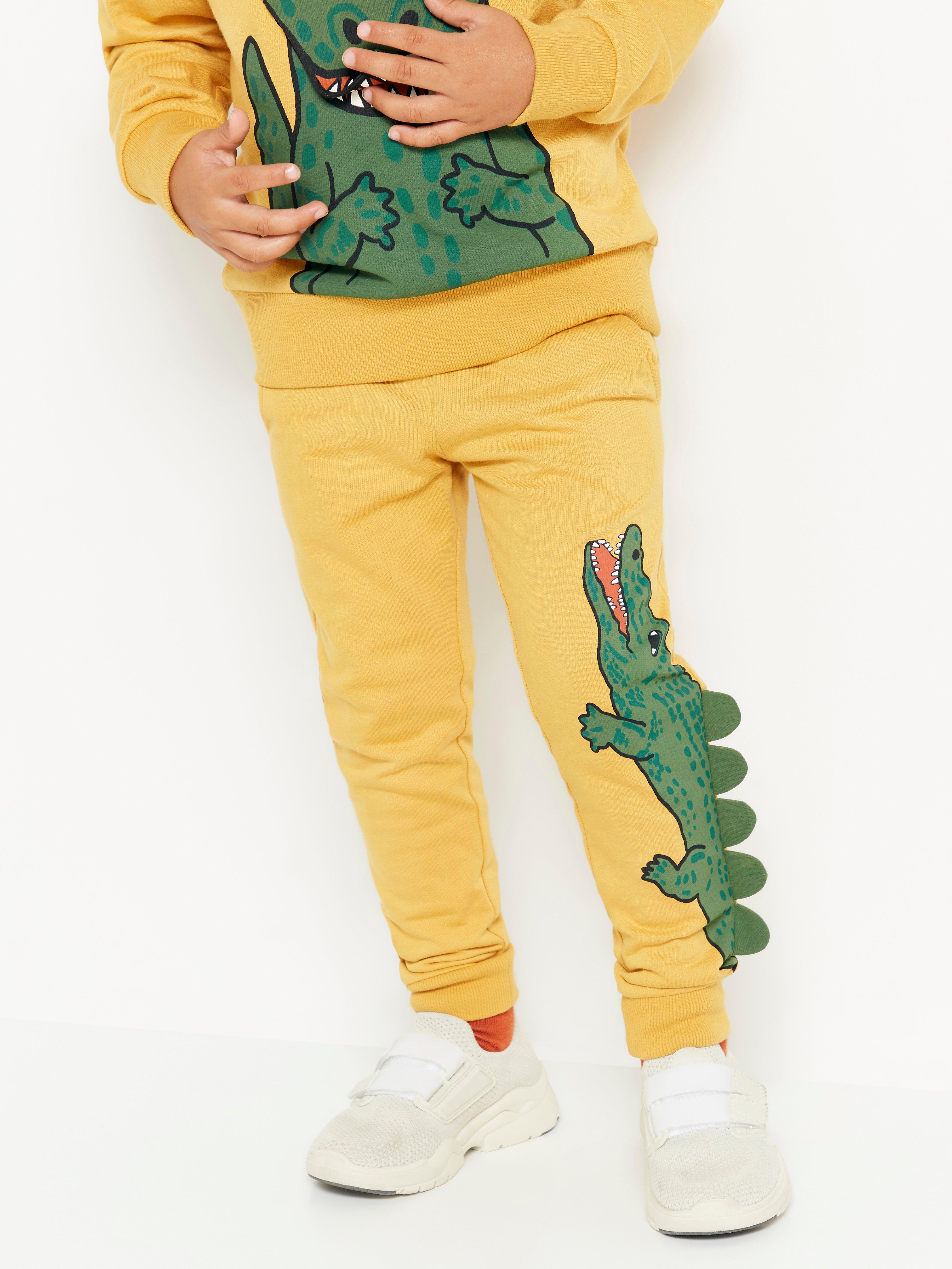 Yellow sweatpants with crocodile