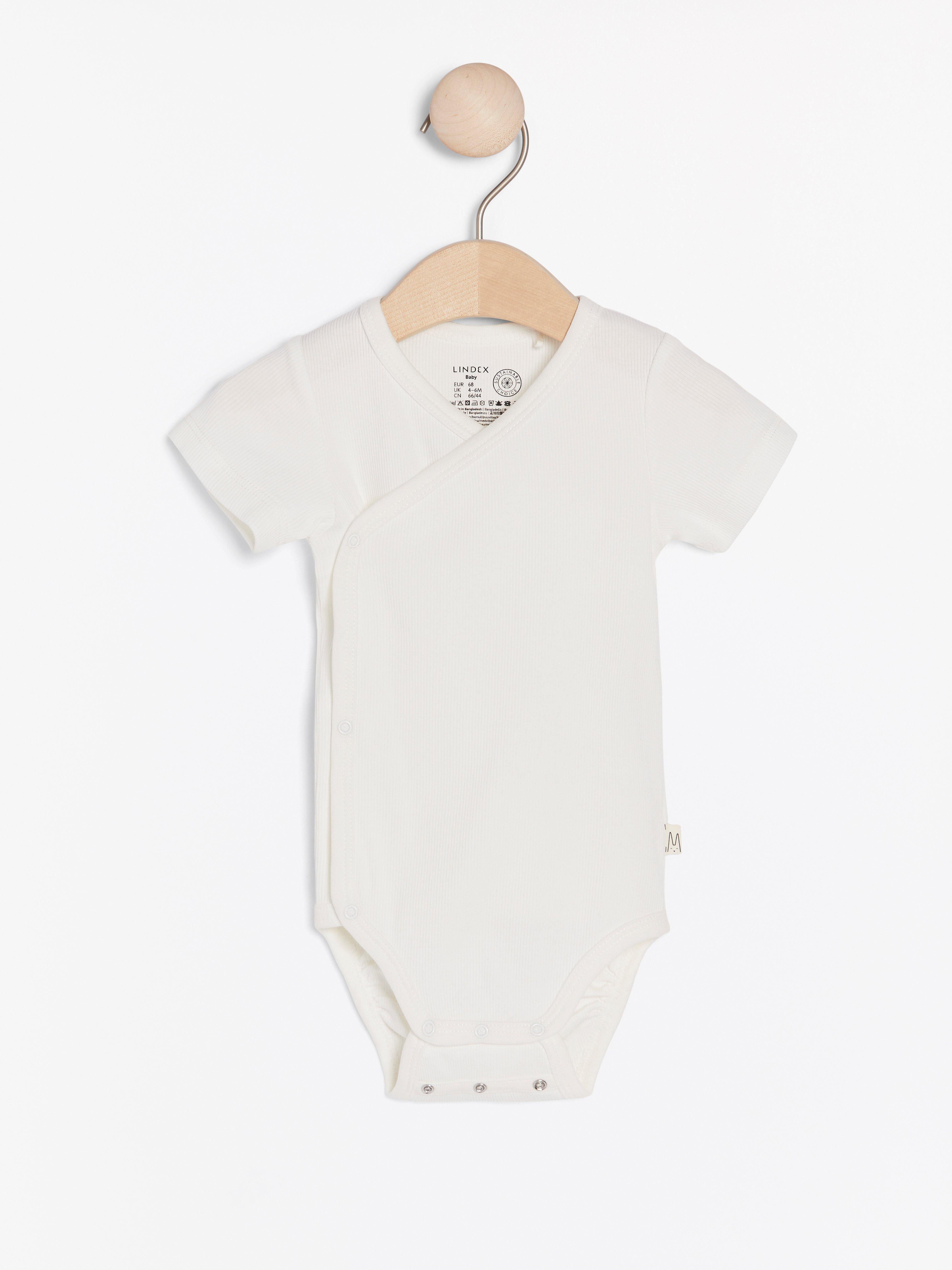 white ribbed bodysuit baby