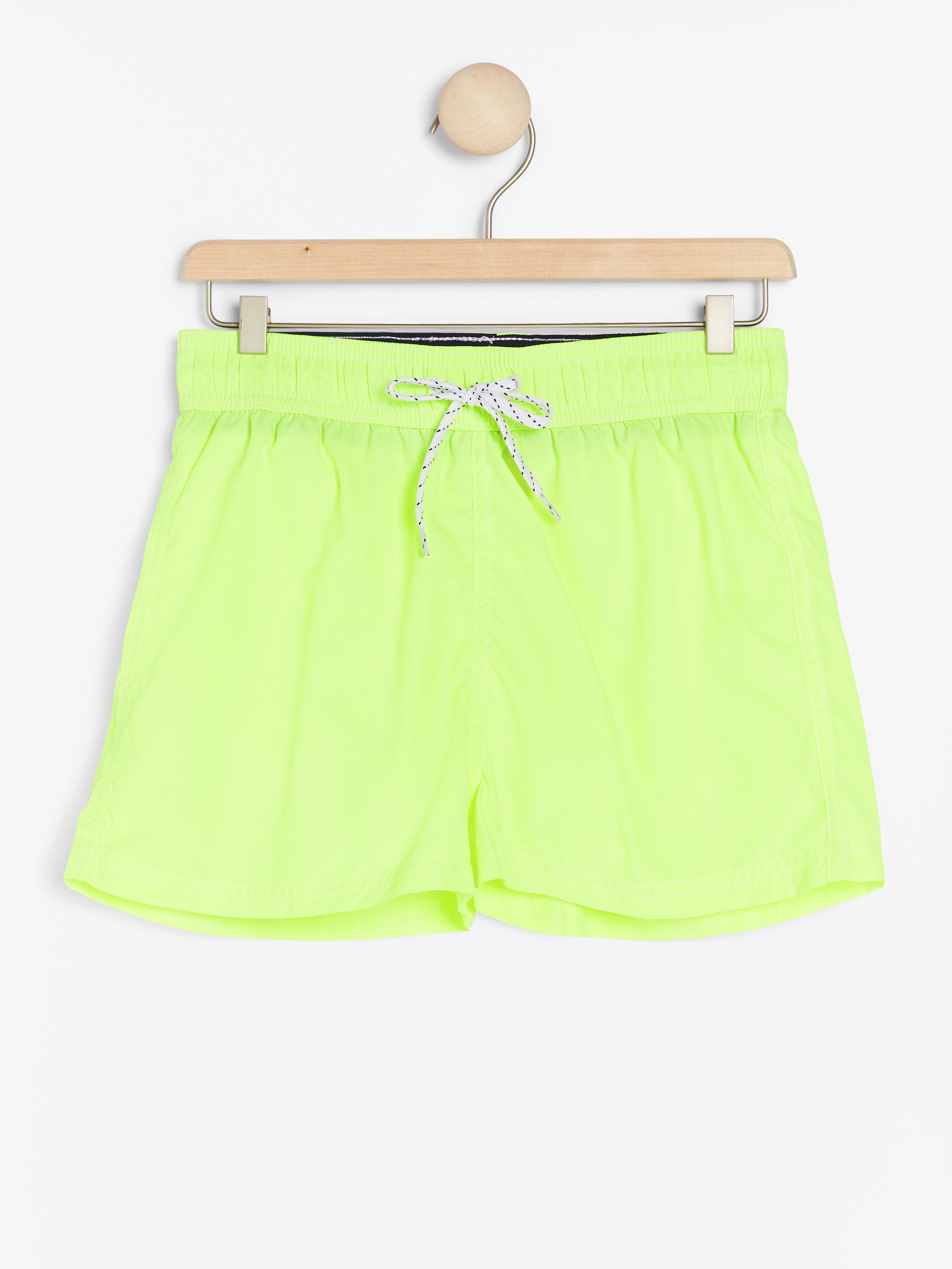 neon yellow swim trunks