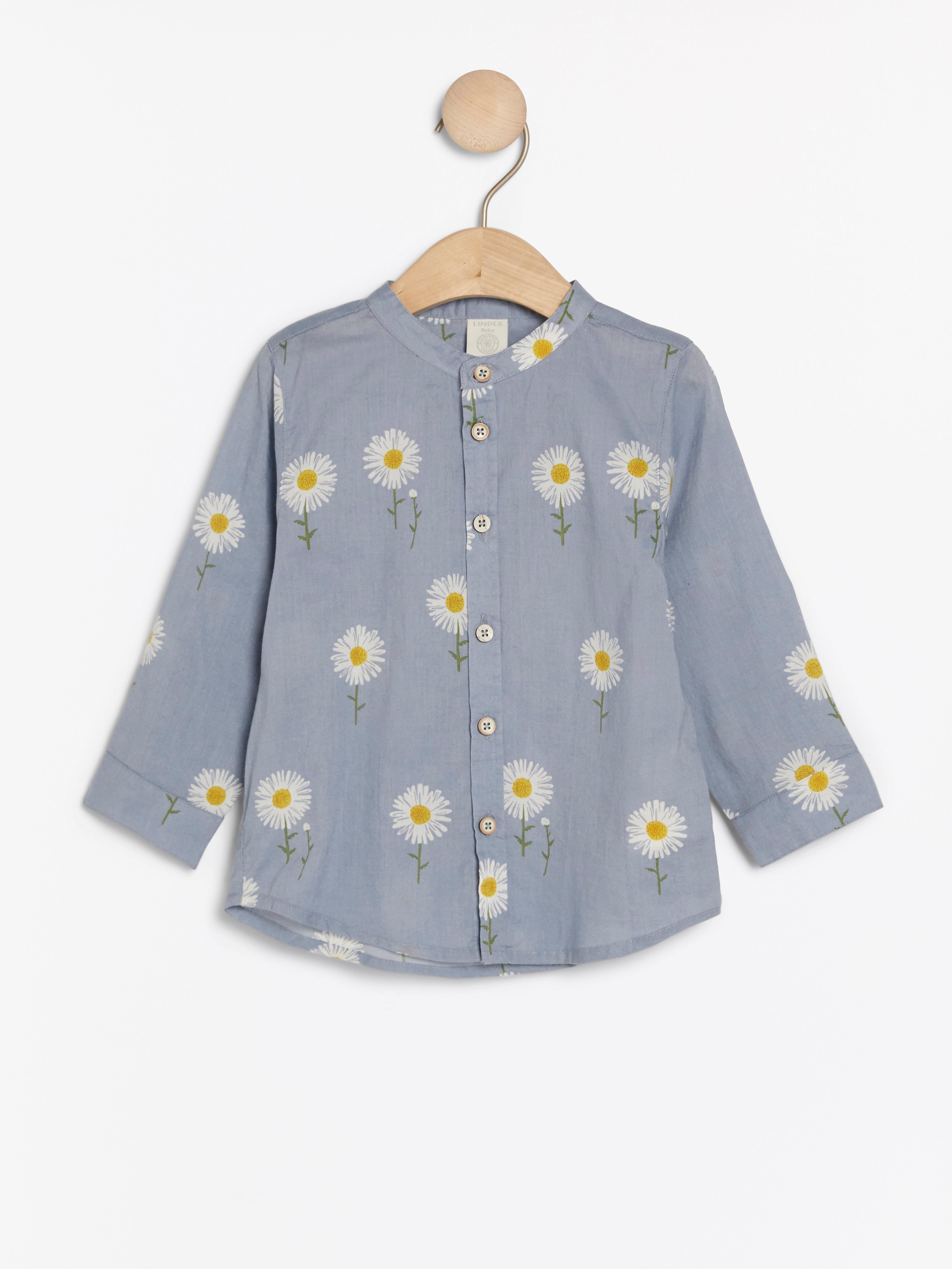 Blue collarless shirt with daisy pattern | Lindex UK