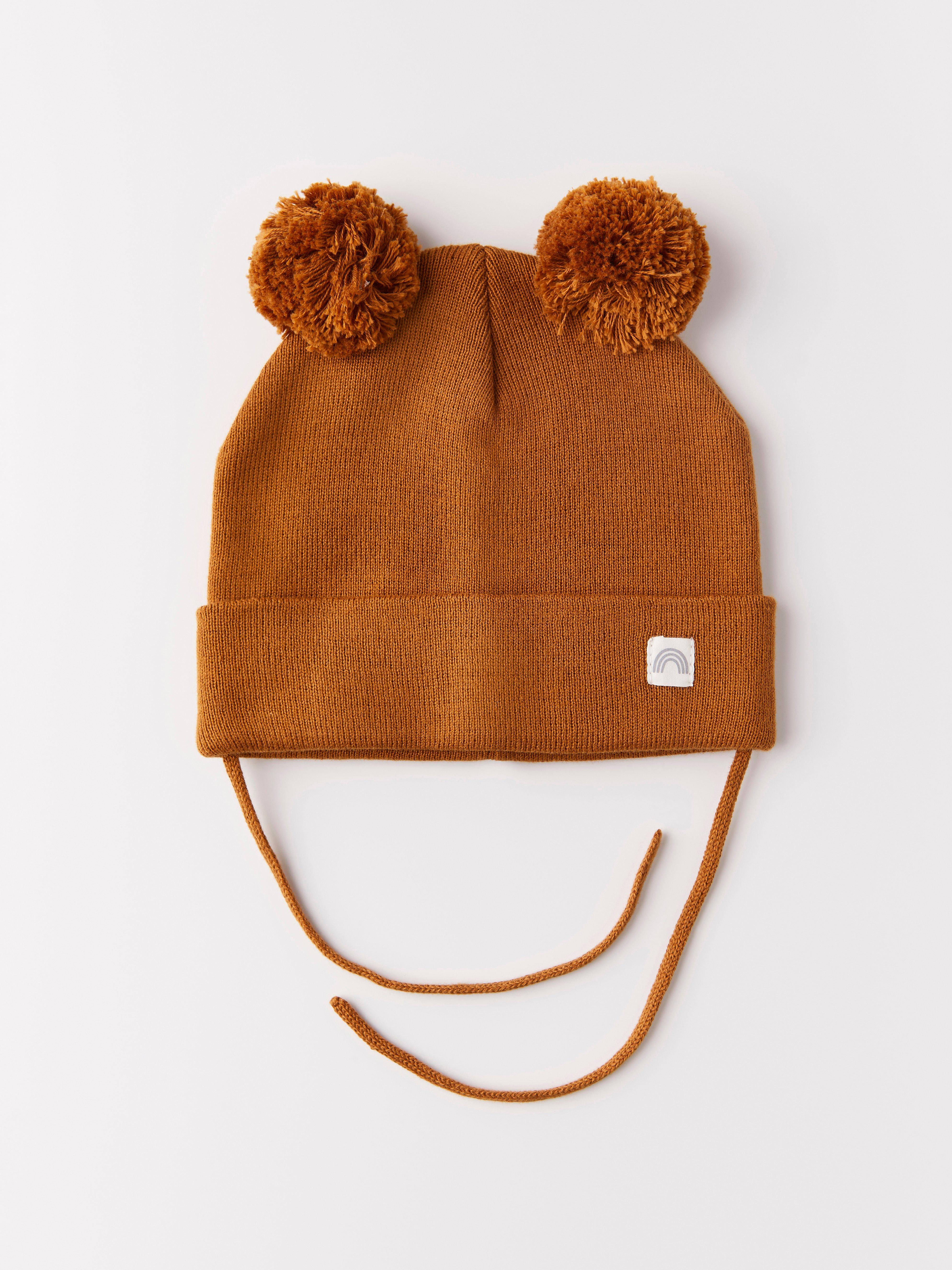 Fine-knit cap with pom poms and tie band