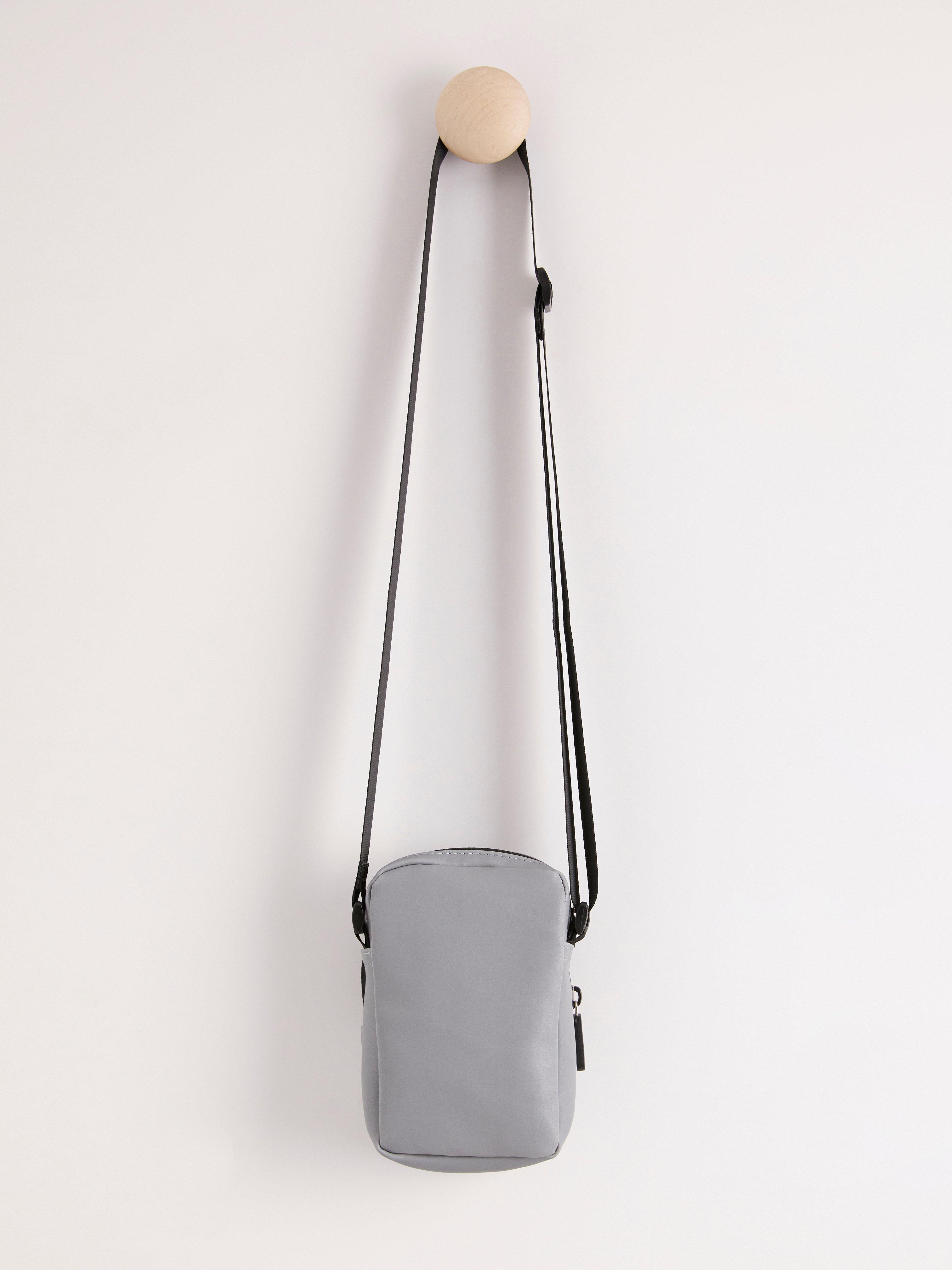 Reflective outlet crossbody bag