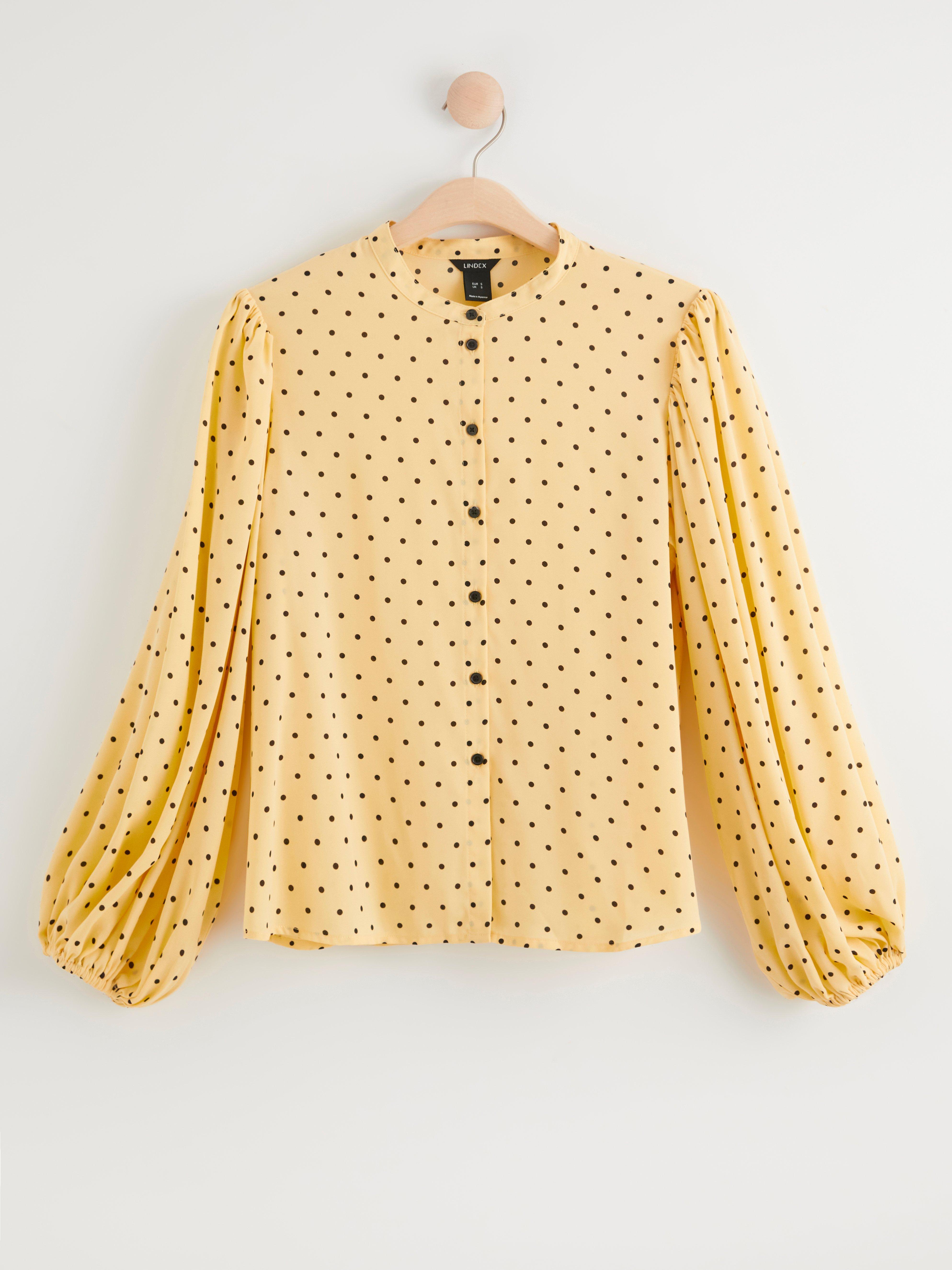 yellow patterned blouse