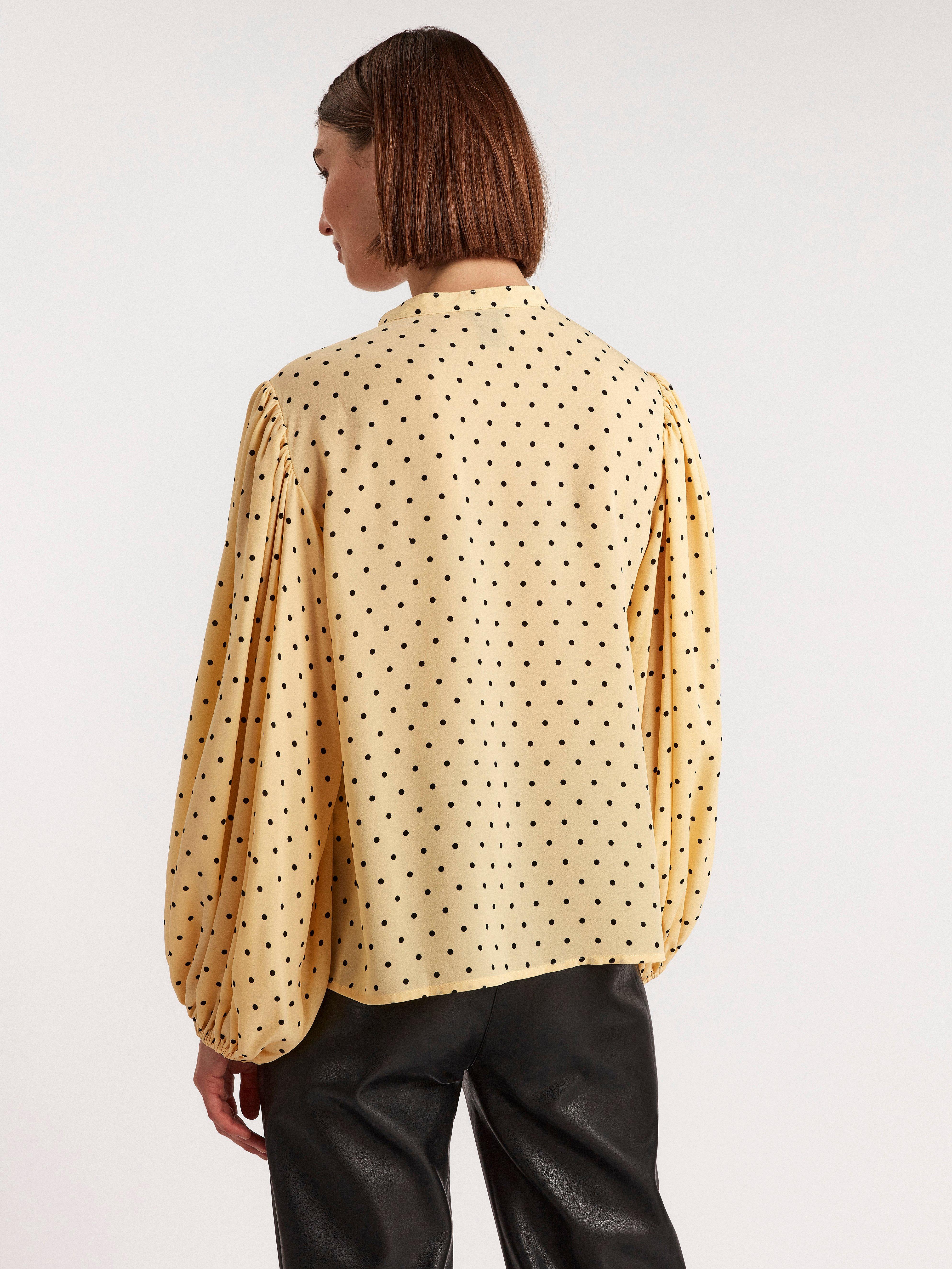 yellow patterned blouse