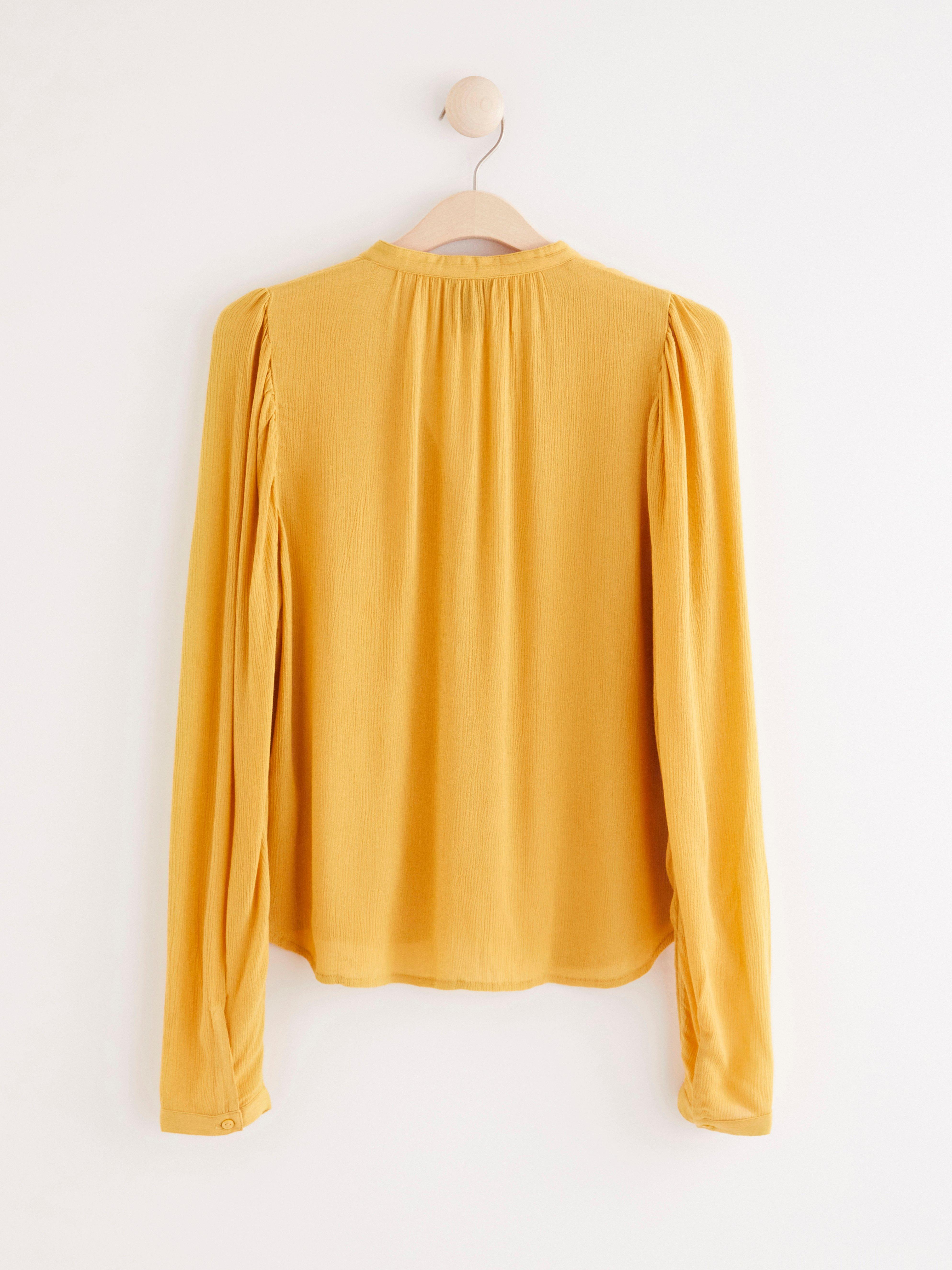 yellow bell sleeve shirt