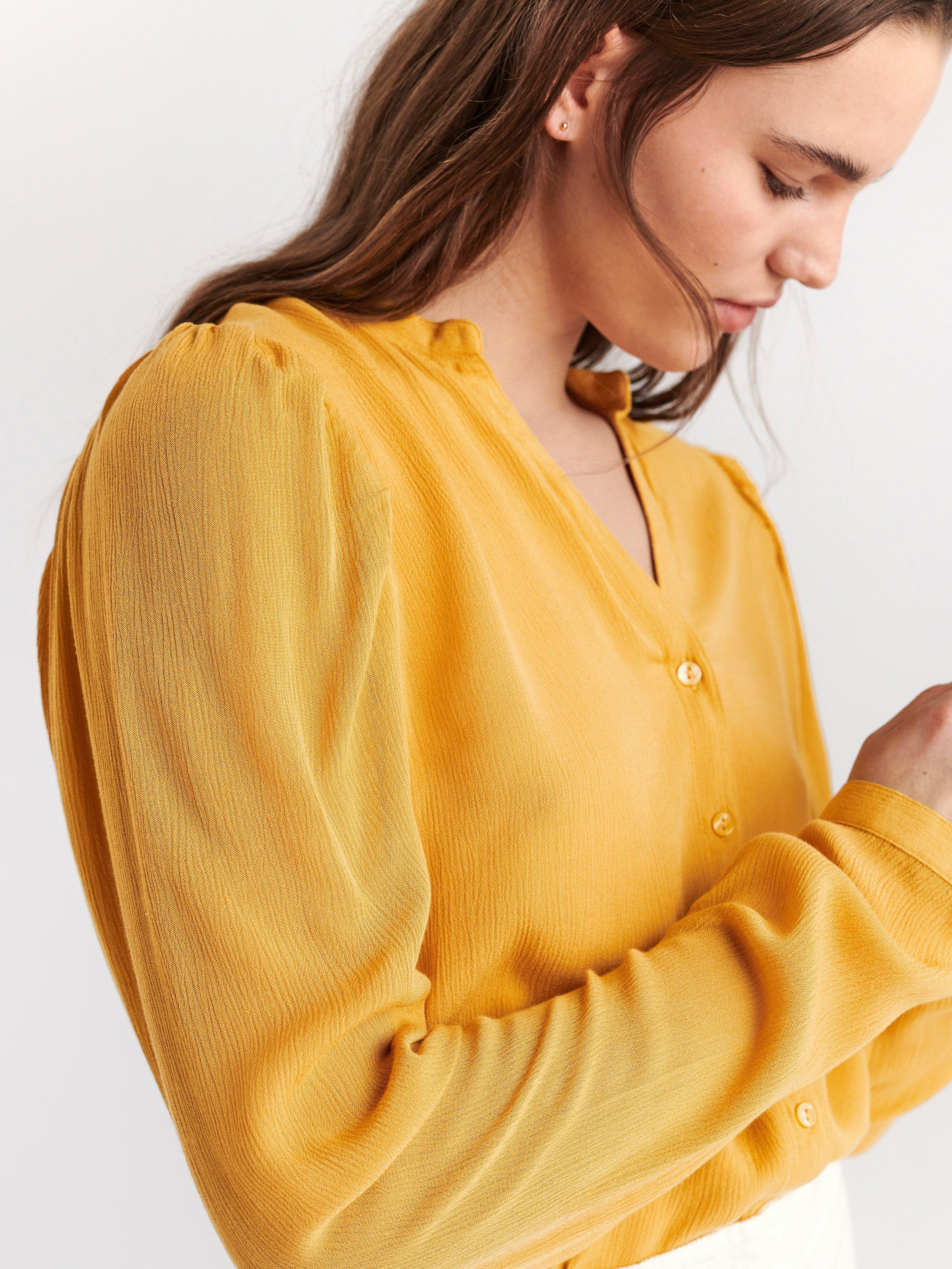 yellow long sleeve blouse