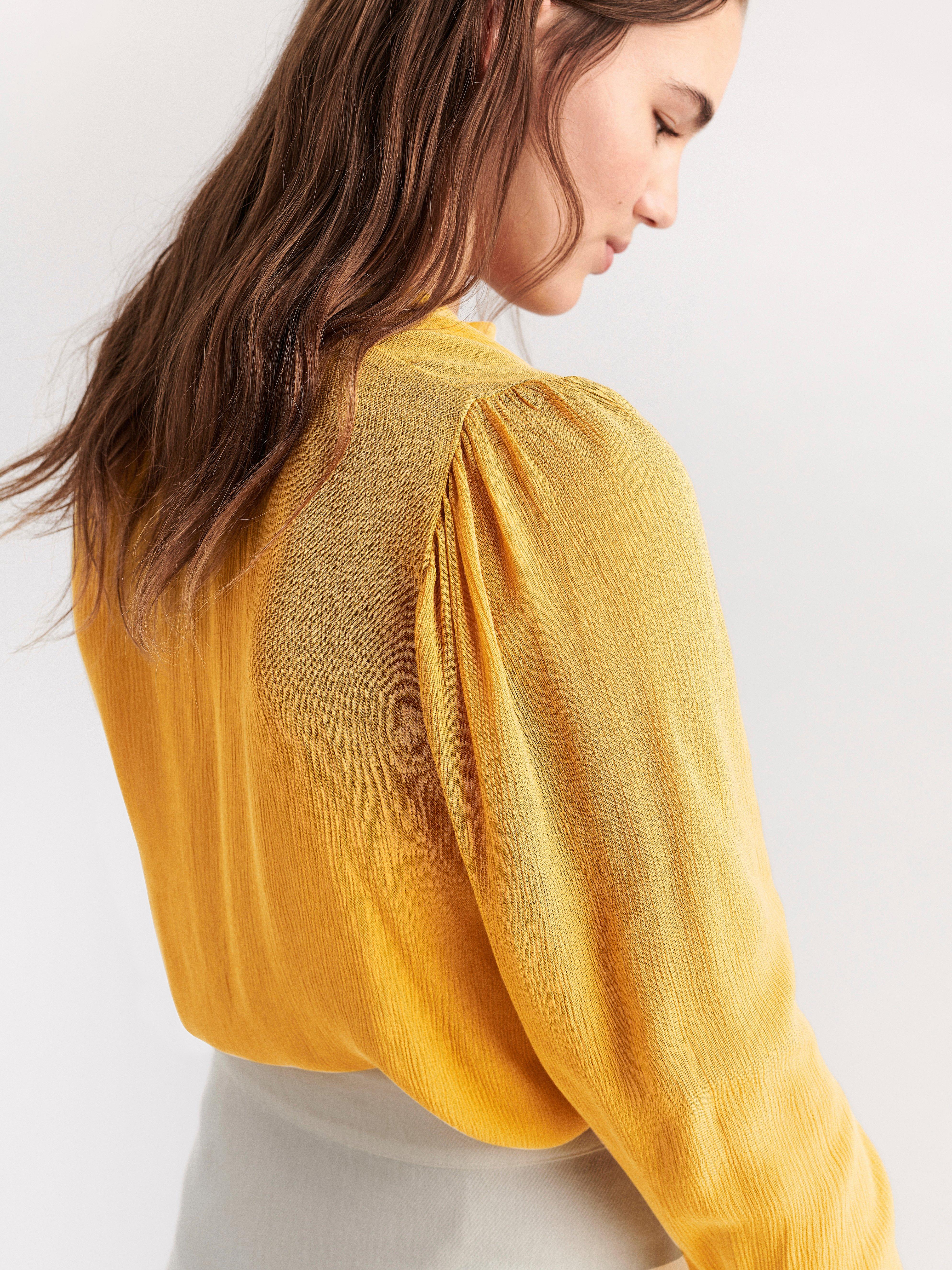 yellow long sleeve blouse