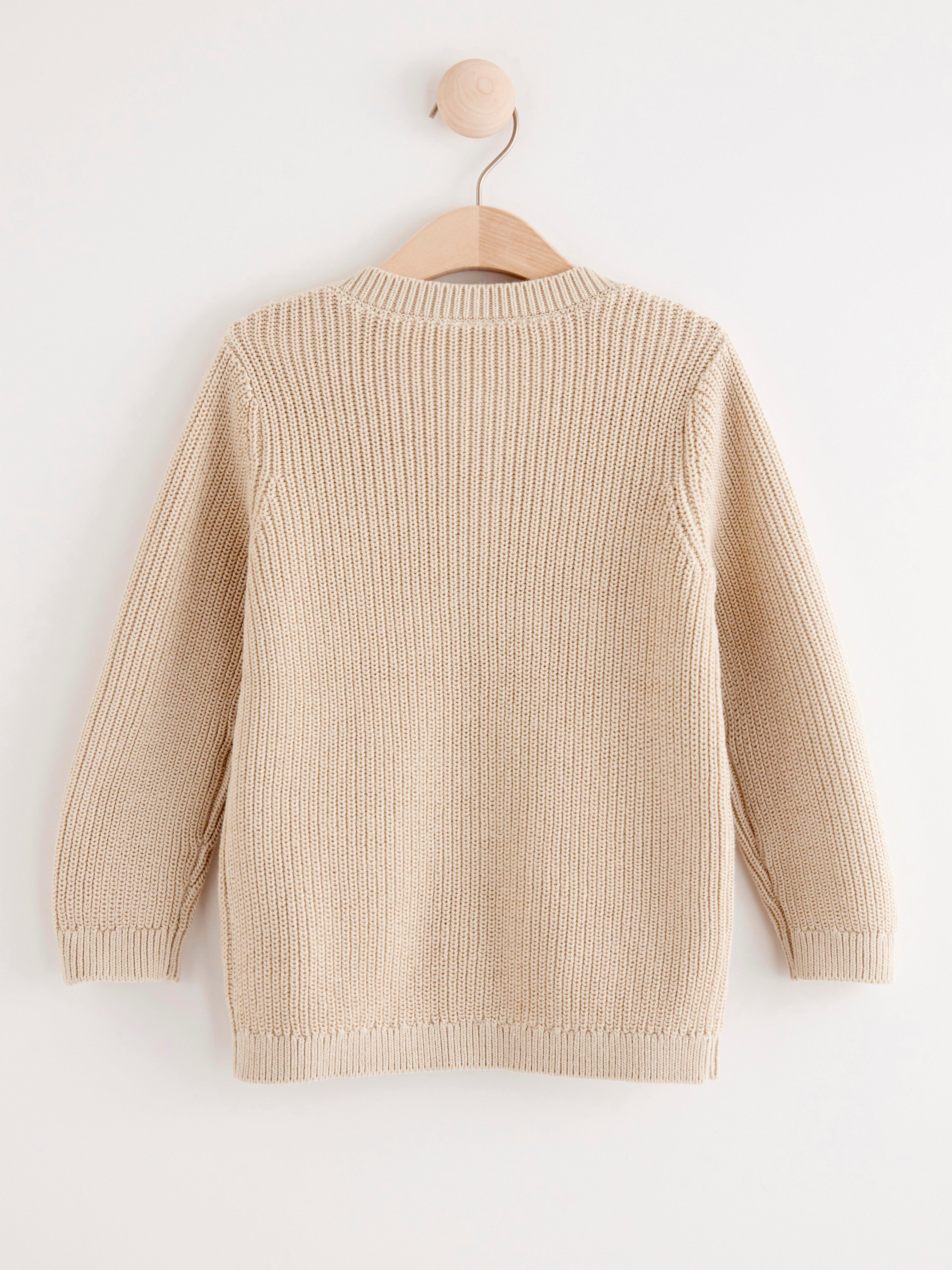 beige cardigan with pockets