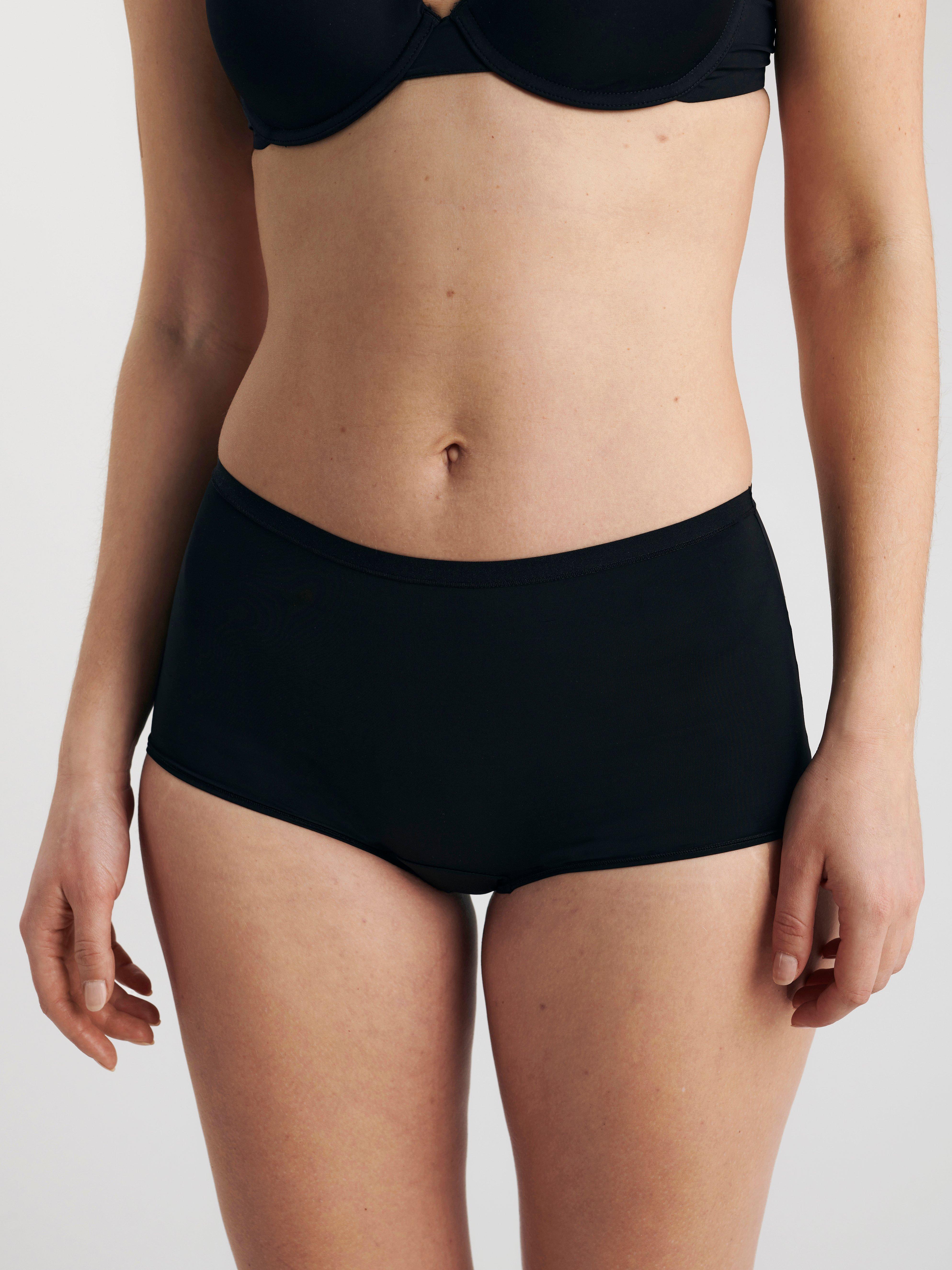 A woman in a pair of midi rise knickers.