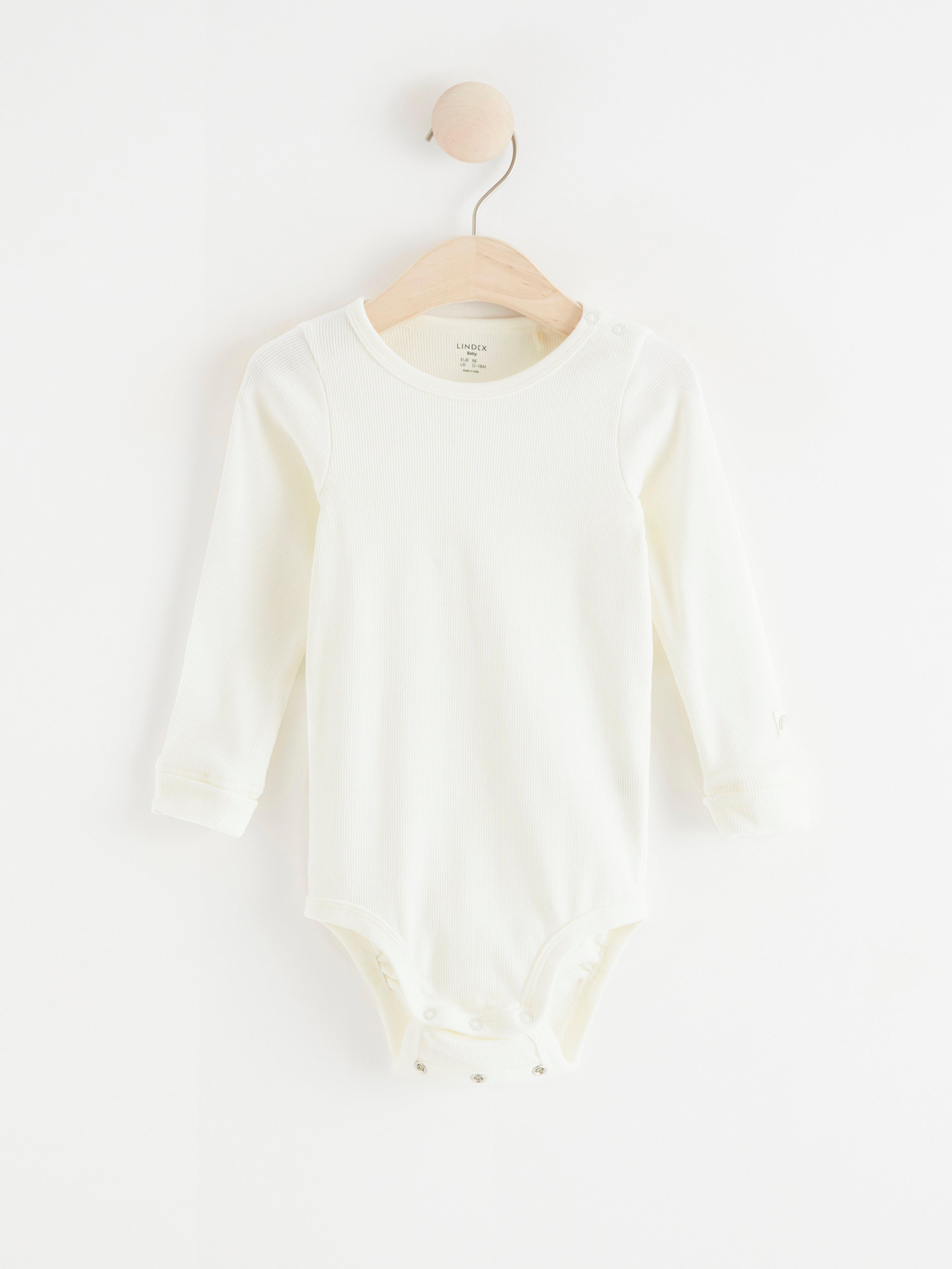 white ribbed long sleeve bodysuit