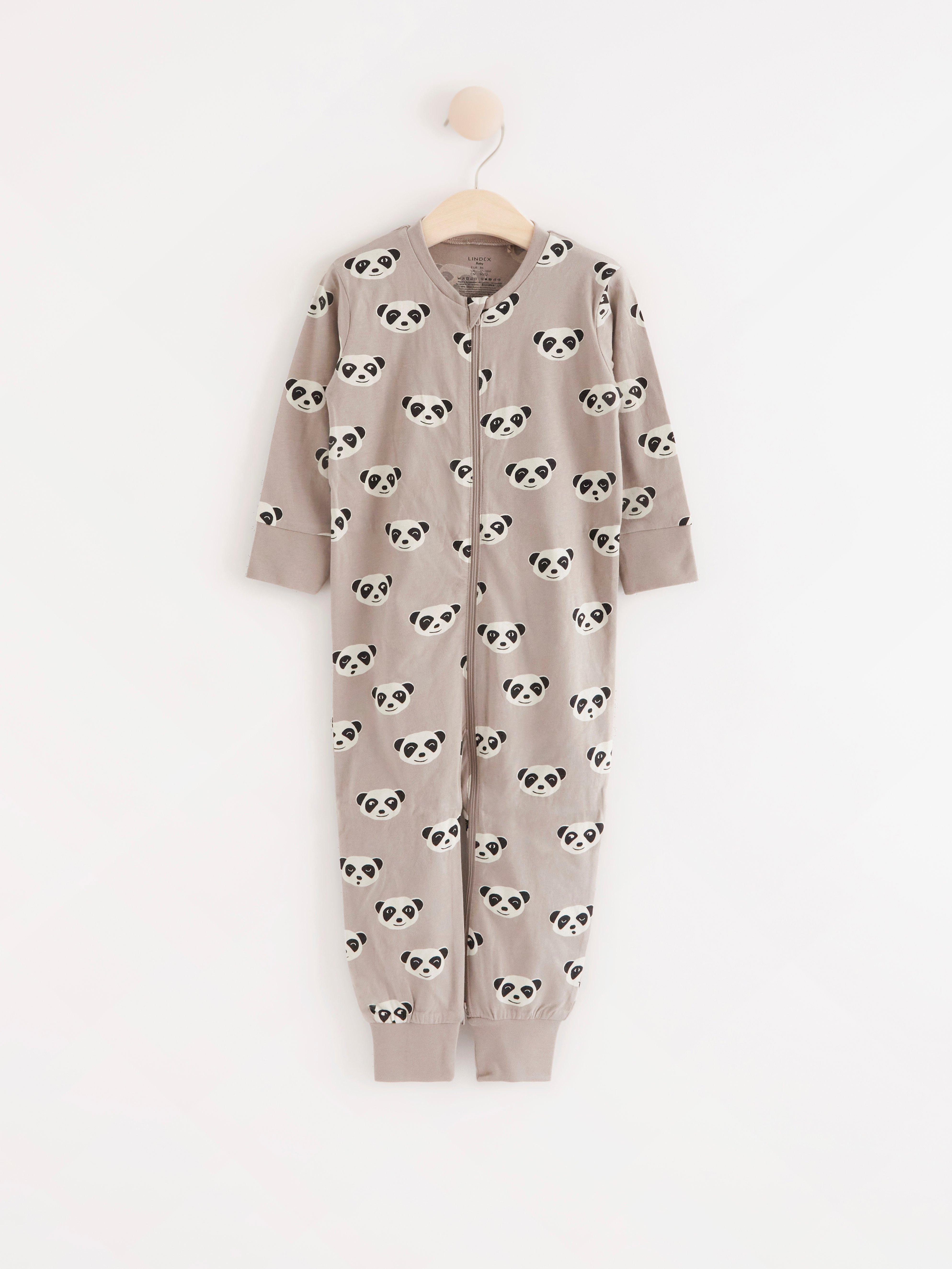 Pyjamas med surikatansikten och applikation baktill
