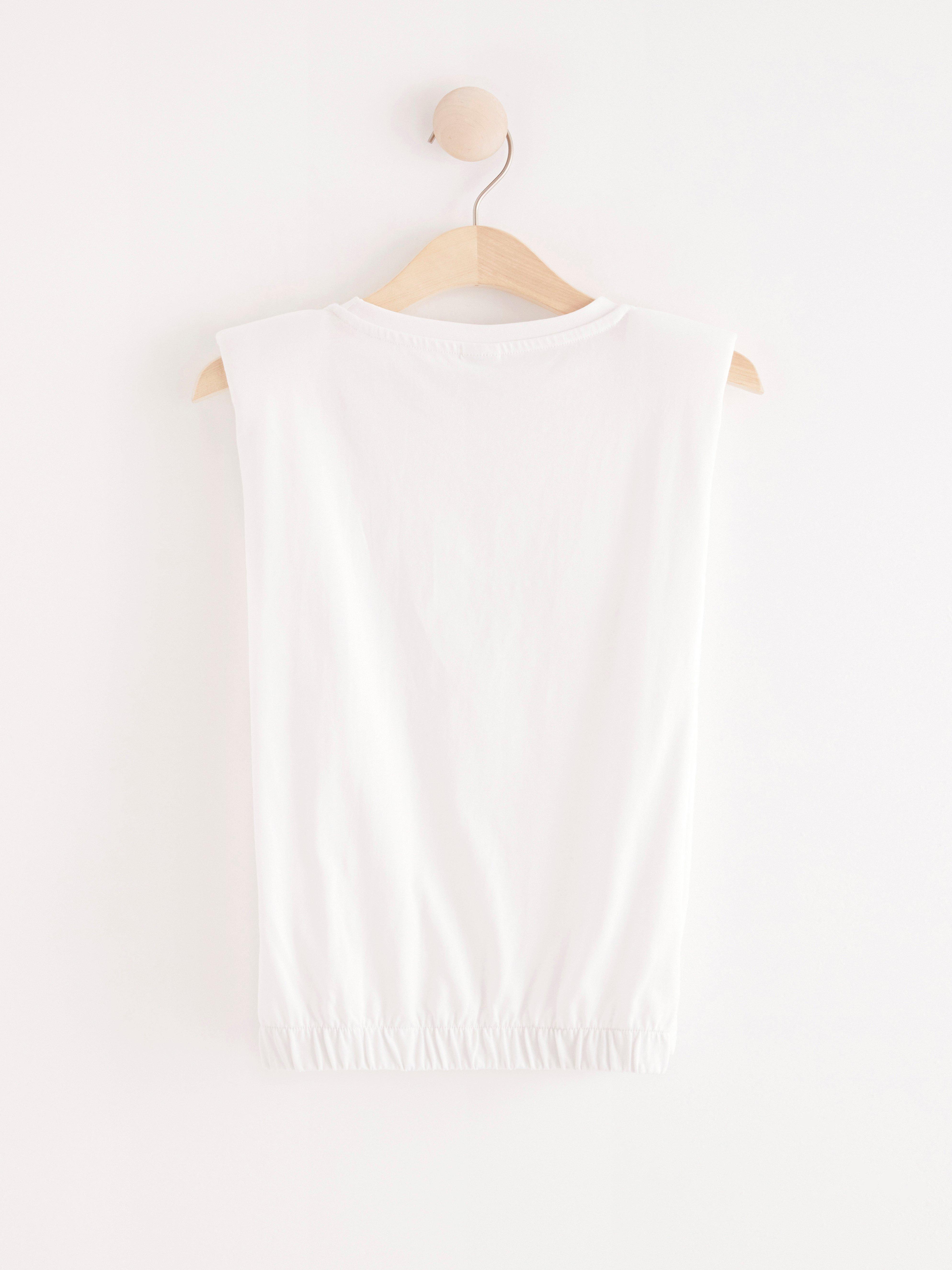 fitted white sleeveless top