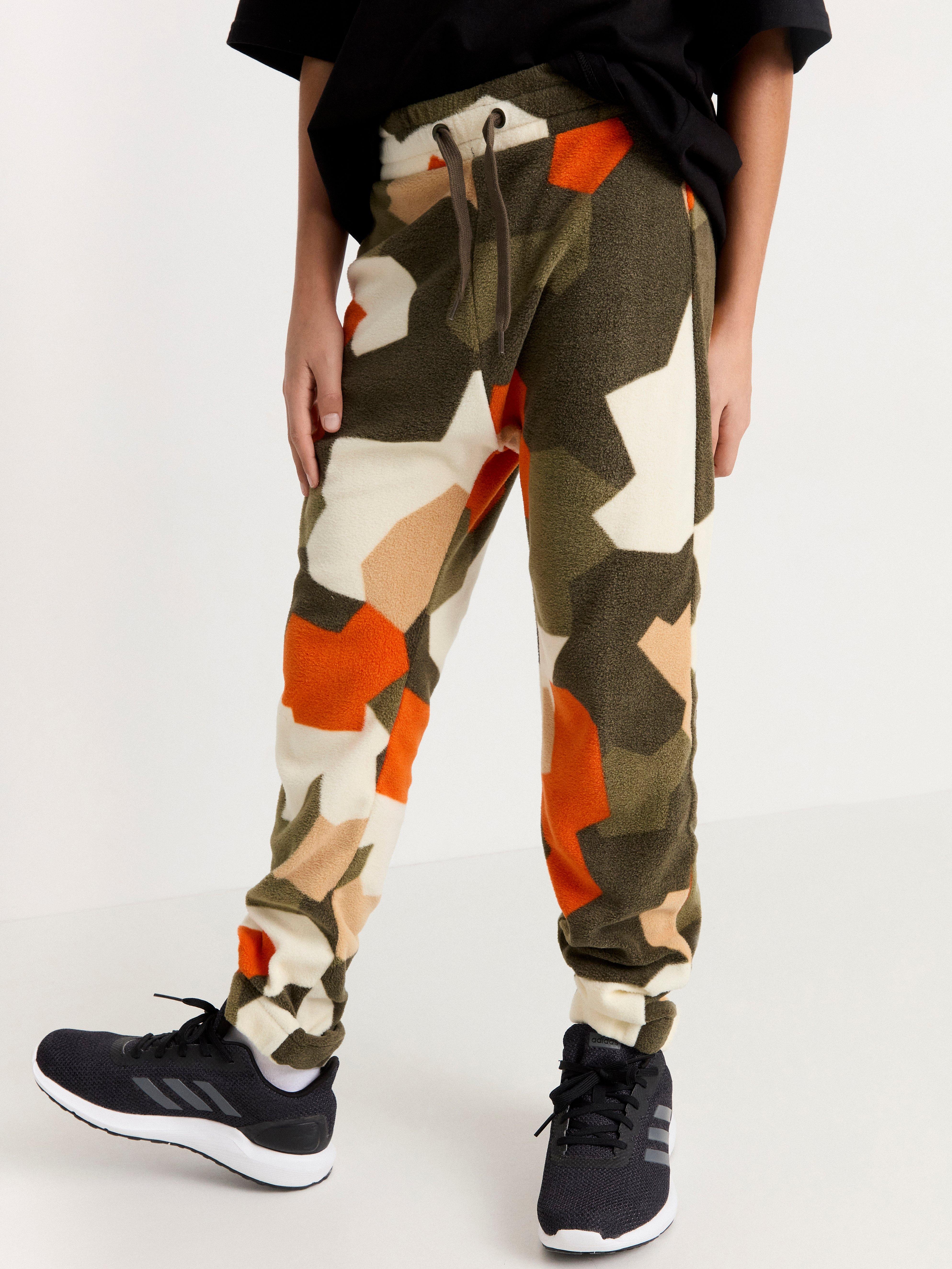 camouflage print trousers